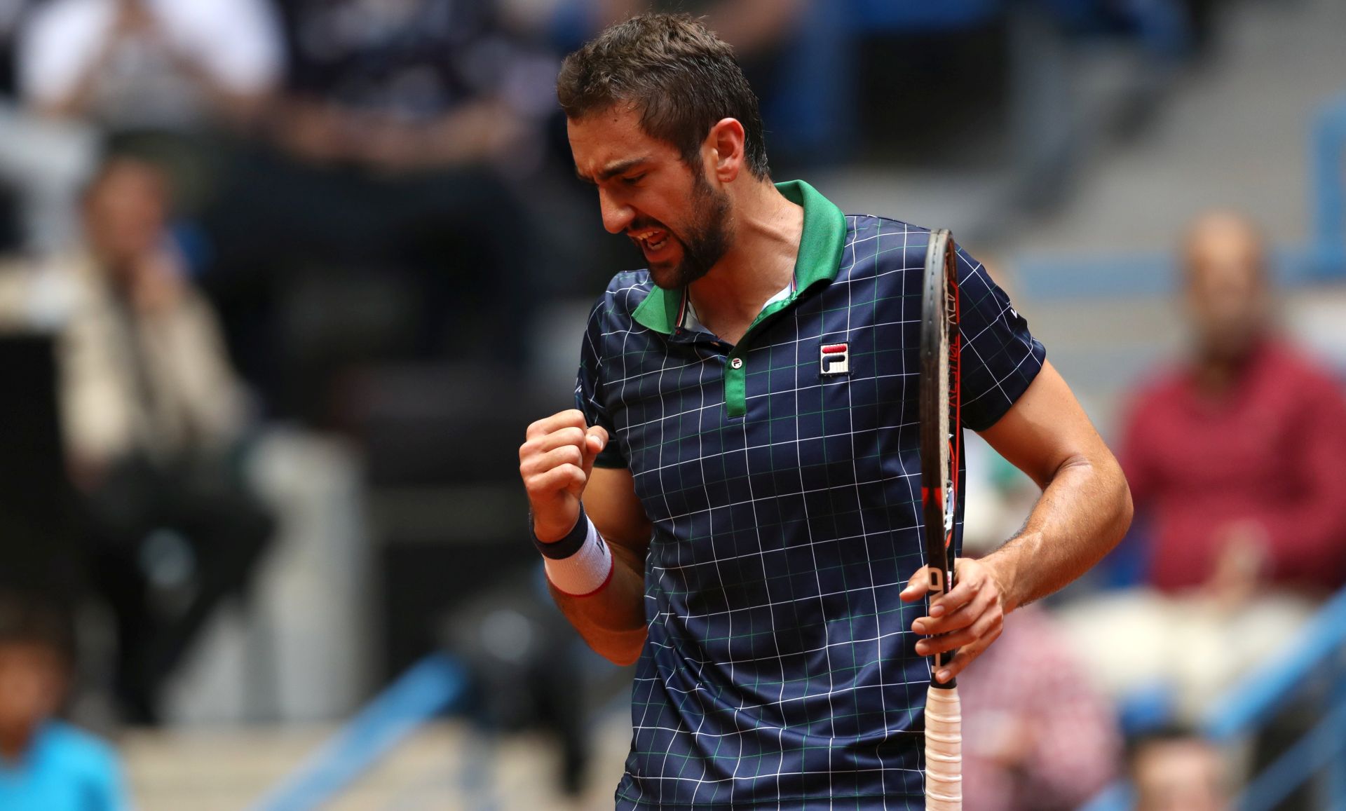 epa05948663 Marin Cilic of Croatia celebrates a point against Milos Raonic of Canada during the final match for the Istanbul Open tennis tournament, in Istanbul, Turkey, 07 May 2017.  EPA/TOLGA BOZOGLU