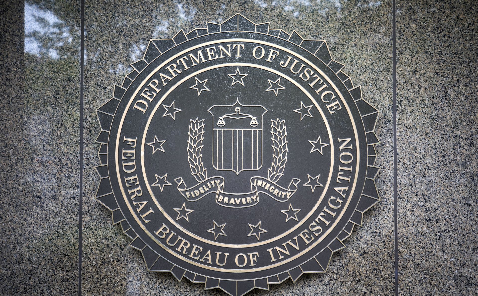 epa05957056 The seal of the Federal Bureau Of Investigation (FBI), the domestic intelligence and security service of the United States, at the facade of the J. Edgar Hoover FBI Building, in Washington, DC, USA, 11 May 2017. U.S. President Donald J. Trump on 09 May 2017 fired FBI director James Comey, regarded a controversial move given that Comey is investigating possible collusion between Russia and the Trump campaign.  EPA/JIM LO SCALZO