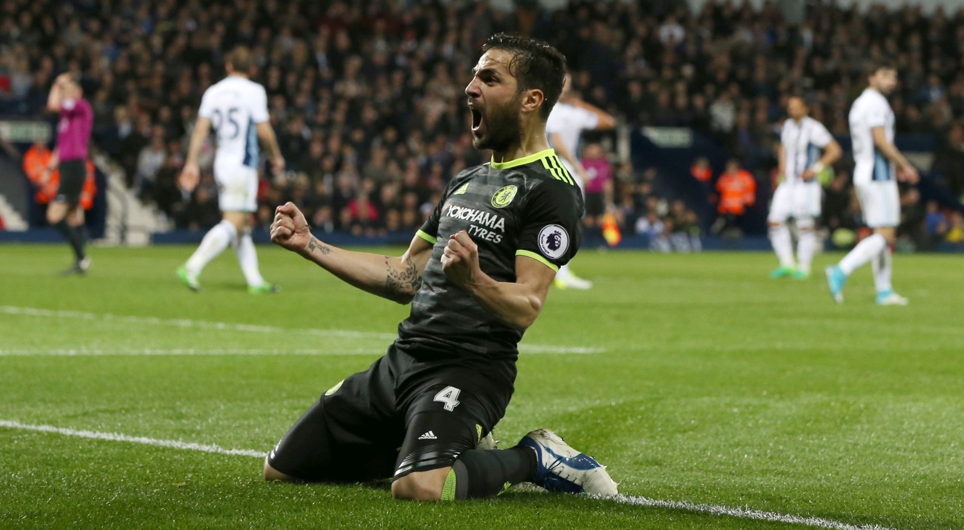 epa05960384 Chelsea's Cesc Fabregas celebrates after teammate Michy Batshuayi (unseen) scored the 1-0 lead  during the English Premier League soccer match between West Bromwich Albion and Chelsea FC at the Hawthorns Stadium in Birmingham, Britain, 12 May 2017.  EPA/NIGEL RODDIS EDITORIAL USE ONLY. No use with unauthorized audio, video, data, fixture lists, club/league logos or 'live' services. Online in-match use limited to 75 images, no video emulation. No use in betting, games or single club/league/player publications.