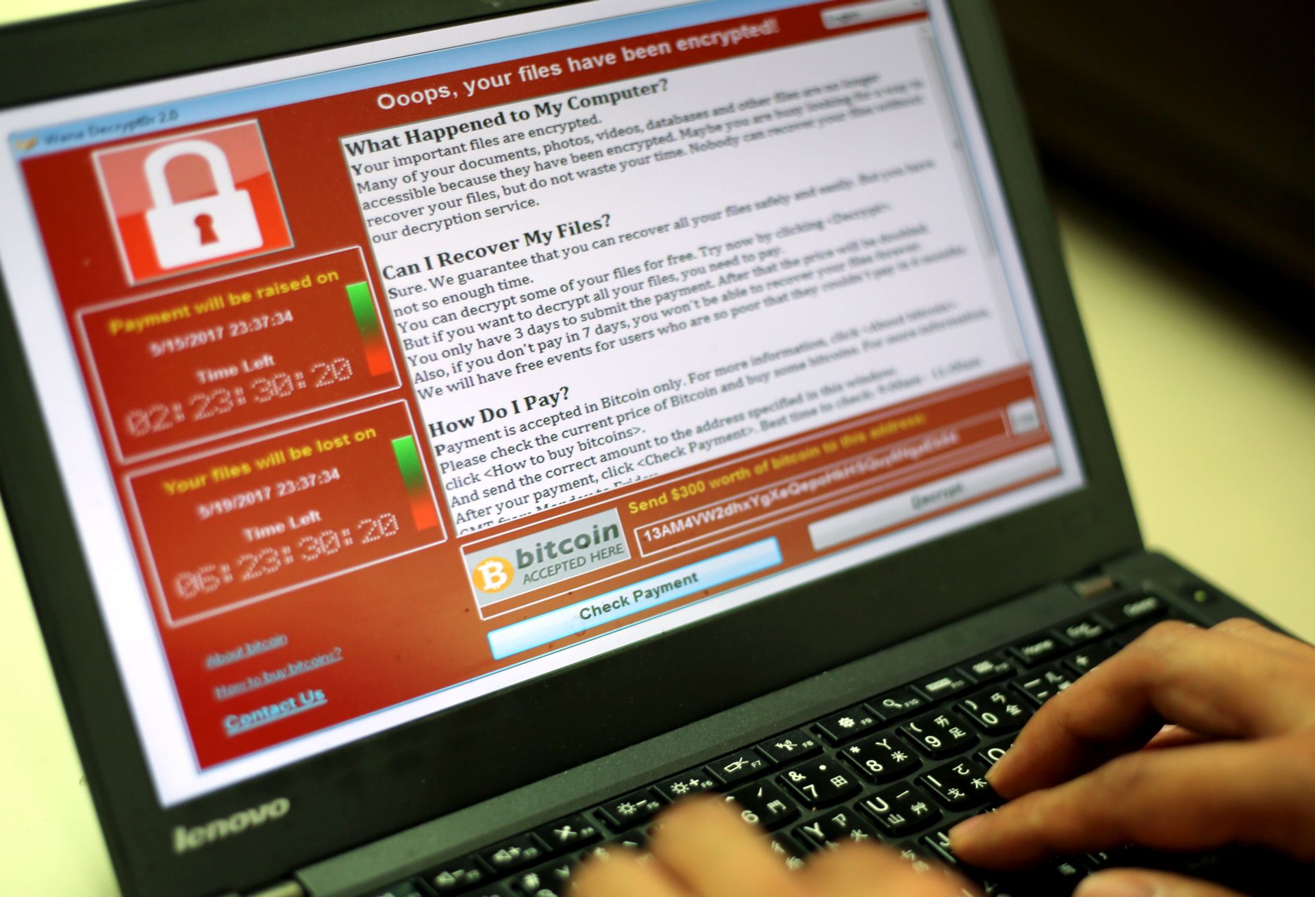 epa05960674 A programer shows a sample of a ransomware cyberattack on a laptop in Taipei, Taiwan, 13 May, 2017. According to news reports, a 'WannaCry' ransomware cyber attack hits thousands of computers in 99 countries encrypting files from affected computer units and demanding 300 US dollars through bitcoin to decrypt the files.  EPA/RITCHIE B. TONGO
