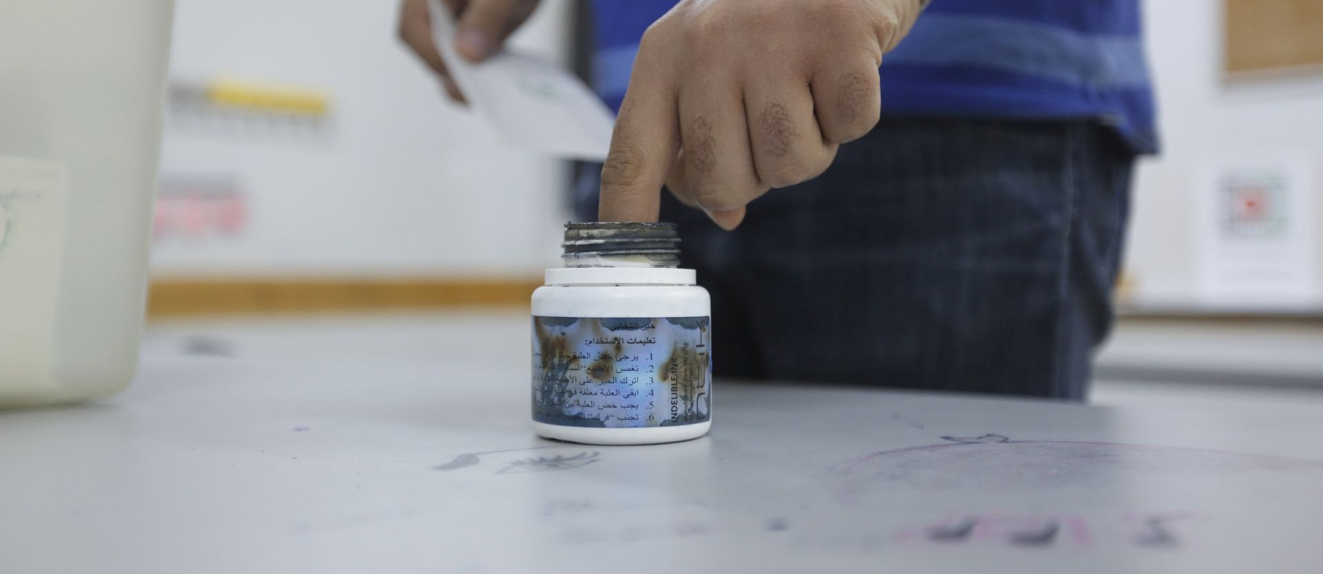 epa05960853 A Palestinian man dips his finger in ink after casting his ballot paper for the municipal elections at a polling station in the West Bank town of Ramallah, 13 May 2017. Reports state local municipal elections will be held in the West Bank only, after the Islamic movement of Hamas refused to hold the elections in the Gaza Strip.  EPA/ALAA BADARNEH