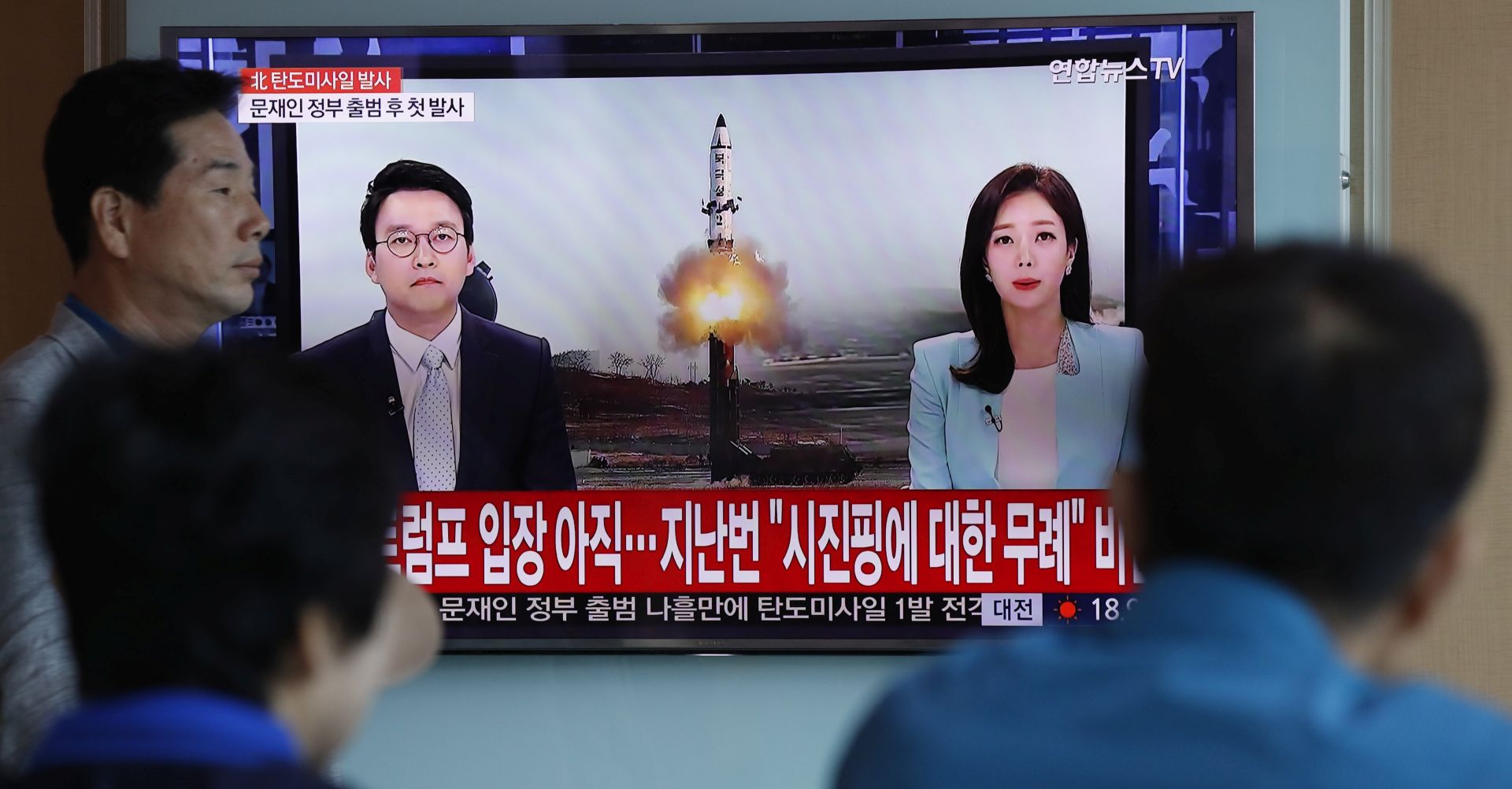 epaselect epa05962689 South Koreans watch a television displaying news broadcasts reporting on North Korea's recent ballistic missile launch, at a station in Seoul, South Korea, 14 May 2017. North Korea launched a ballistic missile earlier in the day on 14 May that flew some 700km, its first military provocation since South Korean President Moon Jae-in took office on 10 May. Moon called the launch a clear violation of UN Security Council resolutions and said he will deal resolutely against such provocations while leaving the door open for dialogue.  EPA/JEON HEON-KYUN