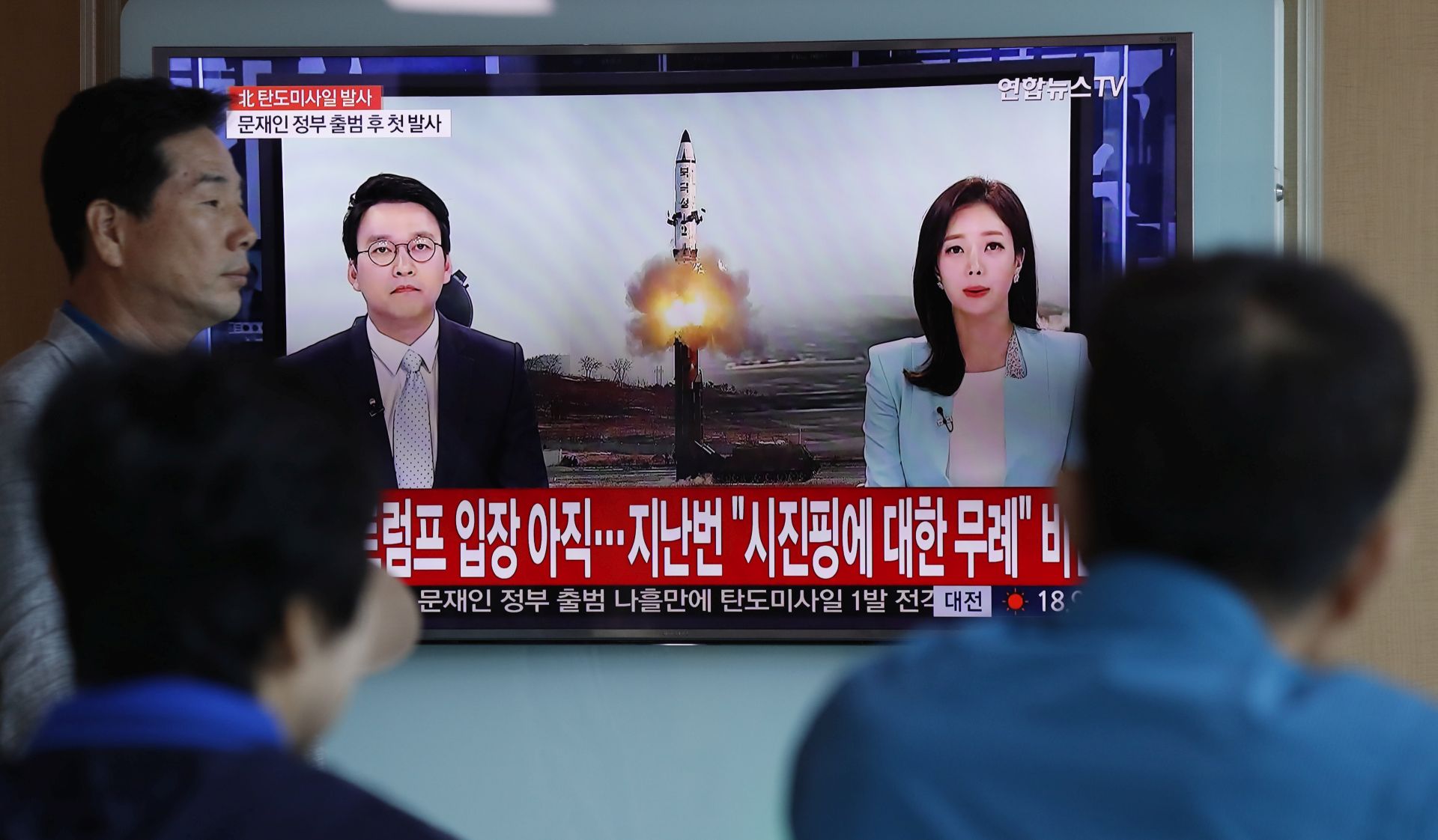 epaselect epa05962689 South Koreans watch a television displaying news broadcasts reporting on North Korea's recent ballistic missile launch, at a station in Seoul, South Korea, 14 May 2017. North Korea launched a ballistic missile earlier in the day on 14 May that flew some 700km, its first military provocation since South Korean President Moon Jae-in took office on 10 May. Moon called the launch a clear violation of UN Security Council resolutions and said he will deal resolutely against such provocations while leaving the door open for dialogue.  EPA/JEON HEON-KYUN