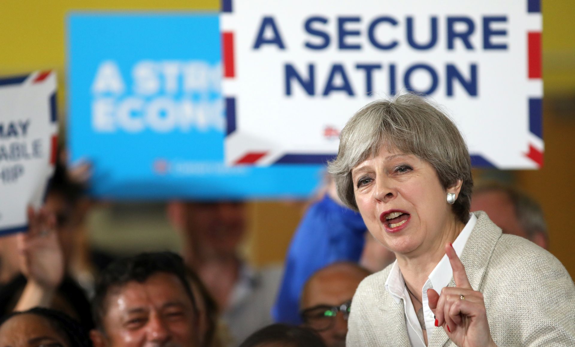 epa05997625 British Prime Minister Theresa May, the leader of the Conservative Party, gestures as she speaks during a campaign event in Twickenham, London, Britain, 29 May 2017. Mays Conservatives maintained their focus on terrorism after the attack on a pop concert on 22 May. The oppositional Labour said the Prime Minister's U-turn on care for the elderly on the same day left many questions unanswered.  EPA/CHRIS J. RATCLIFFE / POOL