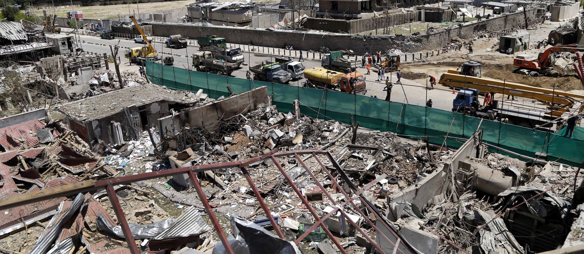 epaselect epa06002715 Workers rebuild the damaged area a day after a suicide bomb attack near foreign embassies in Kabul, Afghanistan, 01 June 2017. At least 90 people were killed and more than 350 were wounded in a suicide bomb attack in Kabul's diplomatic area on 31 May. The German Embassy in the area was severely damaged in the attack, other affected buildings included banks, telecom and media offices, reports say.  EPA/HEDAYATULLAH AMID