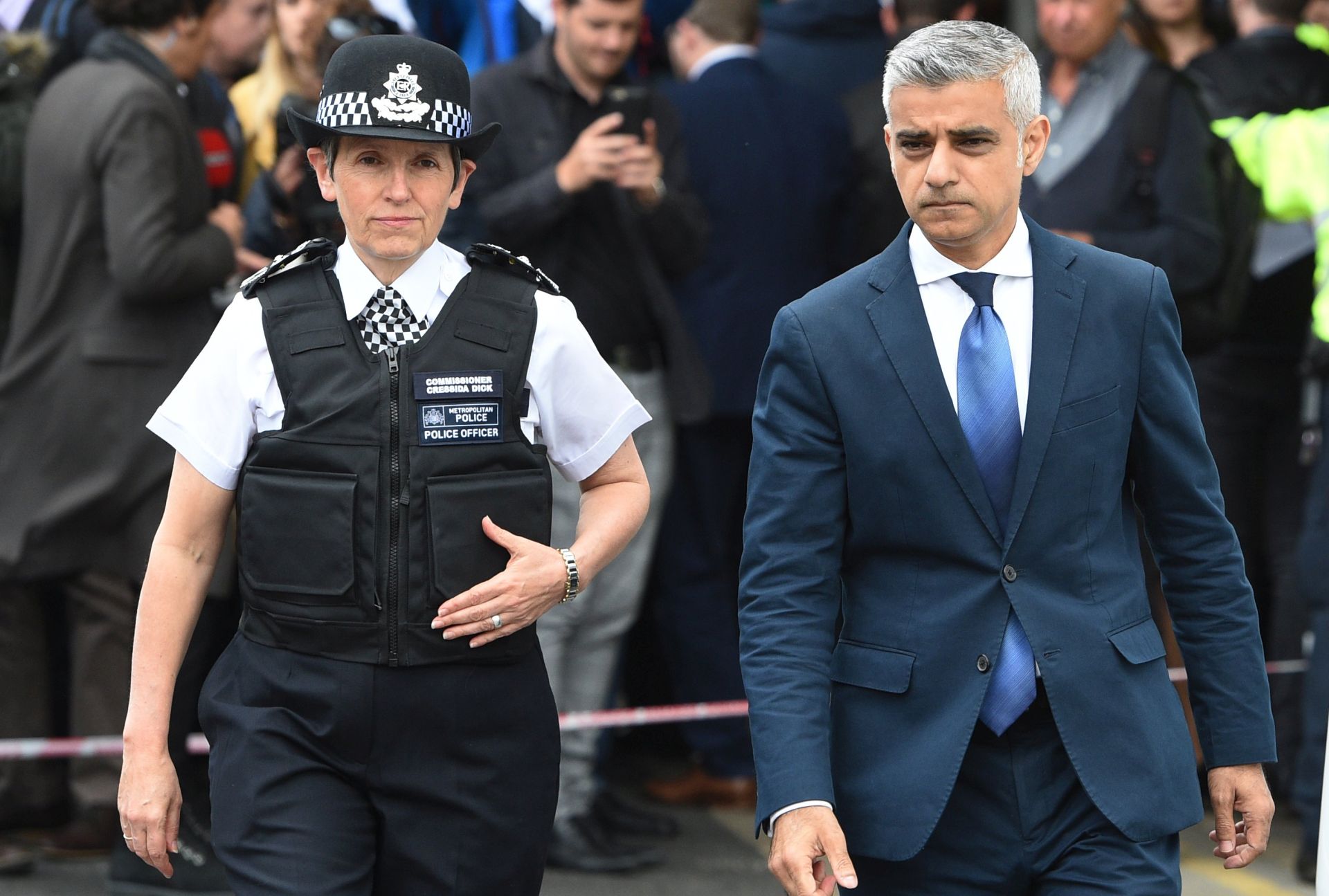 epa06012059 Mayor of London, Sadiq Khan (R) and Metropolitan Police Commissioner, Cressida Dick (C) visit London Bridge after an attack in London, Britain, 05 June 2017. At least seven members of the public were killed and dozens injured after three attackers on late 03 June plowed a van into pedestrians and later randomly stabbed people on London Bridge and nearby Borough Market. The three attackers wearing fake suicide vests were shot dead by police who are treating the attack as a 'terrorist incident'.  EPA/FACUNDO ARRIZABALAGA