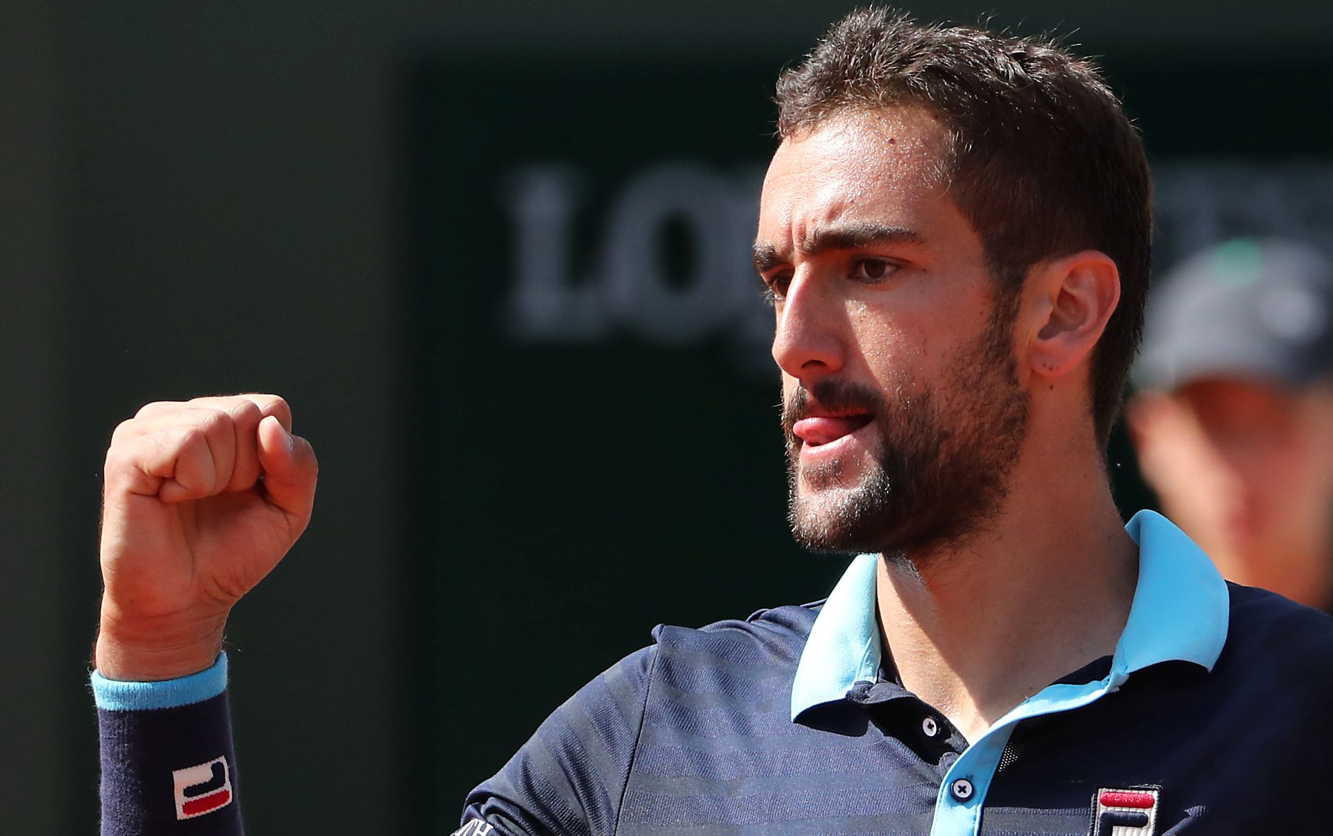epa06012140 Marin Cilic of Croatia reacts as he plays against Kevin Anderson of South Africa during their men’s singles 4th round match during the French Open tennis tournament at Roland Garros in Paris, France, 05 June 2017.  EPA/TATYANA ZENKOVICH