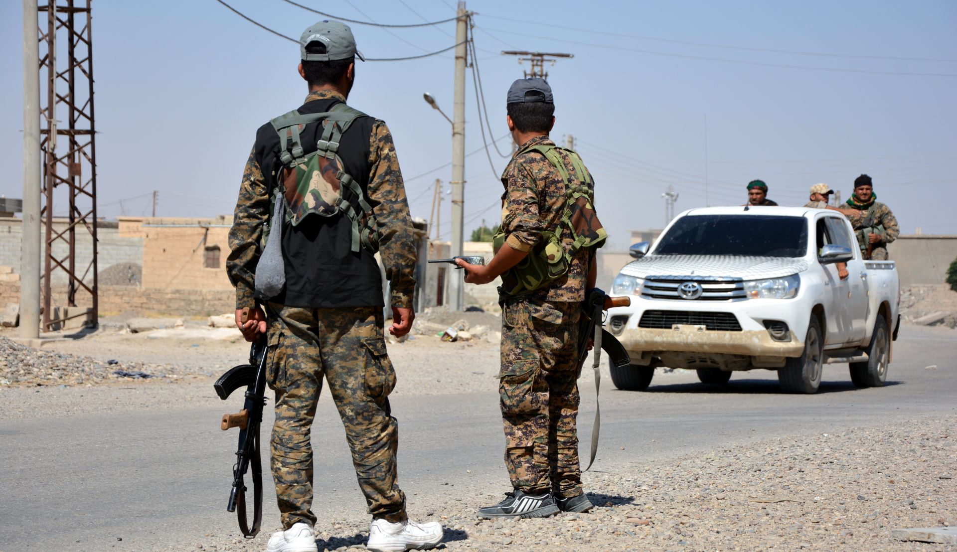 epa06023950 Soldiers stand guard at Raqqa city, Syria, 11 June 2017 (Issued 12 June 2017). The People's Protection Unit (YPG, part of the Syrian Democratic Forces, SDF) advanced on the neighbourhoods of al-Sabahyah and al-Jazrah in Raqqa city with the support of the US-led international coalition to fight IS in Syria. Raqqa city is the main stronghold and the capital of IS in Syria and has been under their control since 2014. The operation to recapture it started on 06 June 2017 under the name 'The Grand Battle' by the Syrian Democratic Forces (QSD or SDF) and supported by a US-led coalition.  EPA/YOUSSEF RABIE YOUSSEF