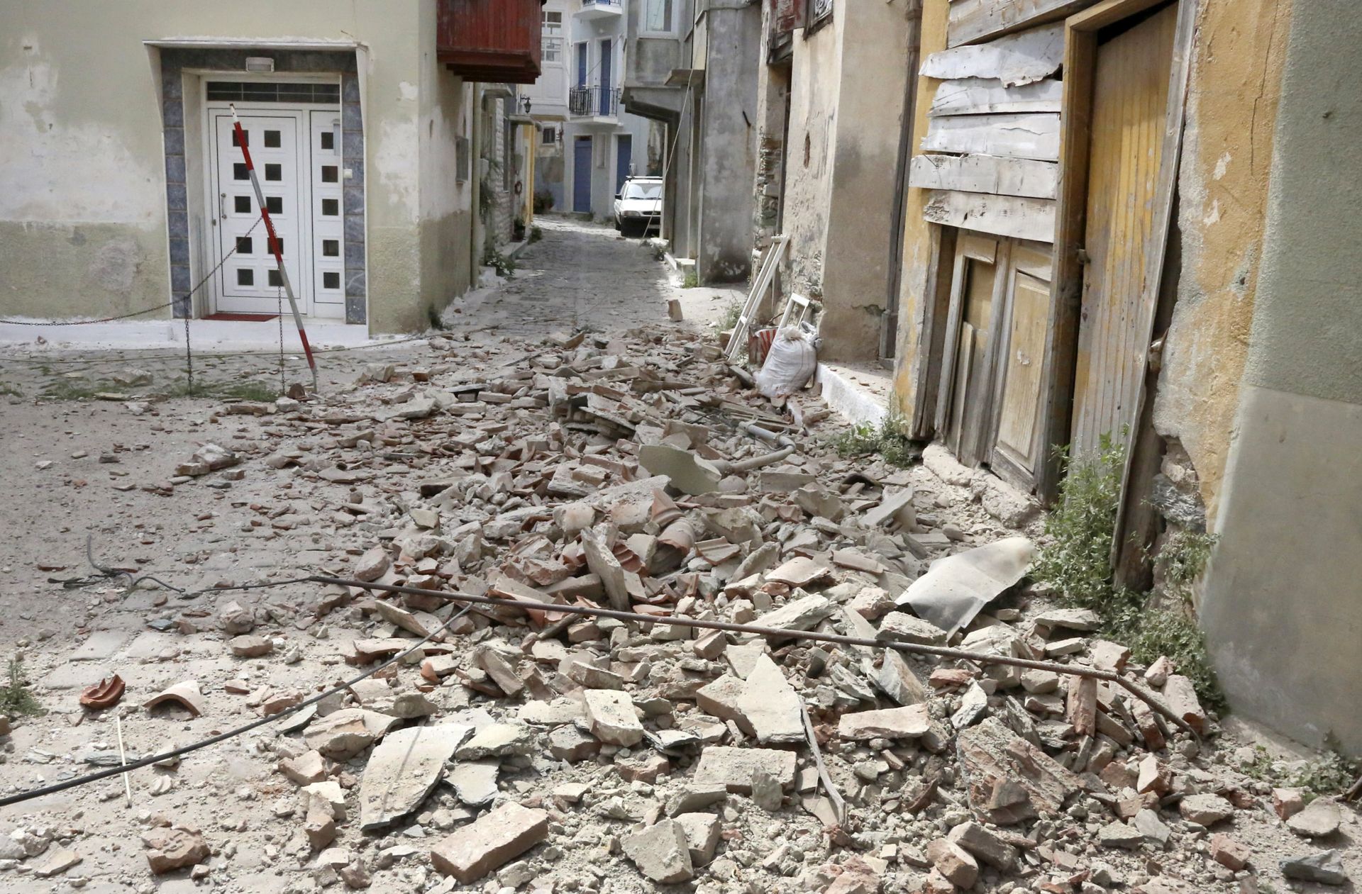 epa06024472 Damage in Plomari village after a strong earthquake struck Lesvos island, in Greece, 12 June 2017. A strong earthquake measuring at least 6.1 on the Richter scale shook Lesvos island at 15:28 (local time) as measured by the Geodynamic Institute in Athens, or 6.3 on the Richter scale according to the European-Mediterranean Seismological Centre (EMSC). The epicentre of the quake was located in the sea 14 km south of Plomari and 34 km from Mytilene, between the island and the coast of Turkey. According to initial reports from the island, the quake has caused damage to buildings in the south and the collapse of old houses in the village of Plomari, as well as the dome on Agios Panteleimonas Church. The central road from Mytilene to Plomari and Melinta is closed due to rockfall near Agios Isidoros while Plomari Deputy Mayor Manolis Armenakas said damage has been reported in the village of Plagia.  EPA/MANOLIS LAGOUTARIS