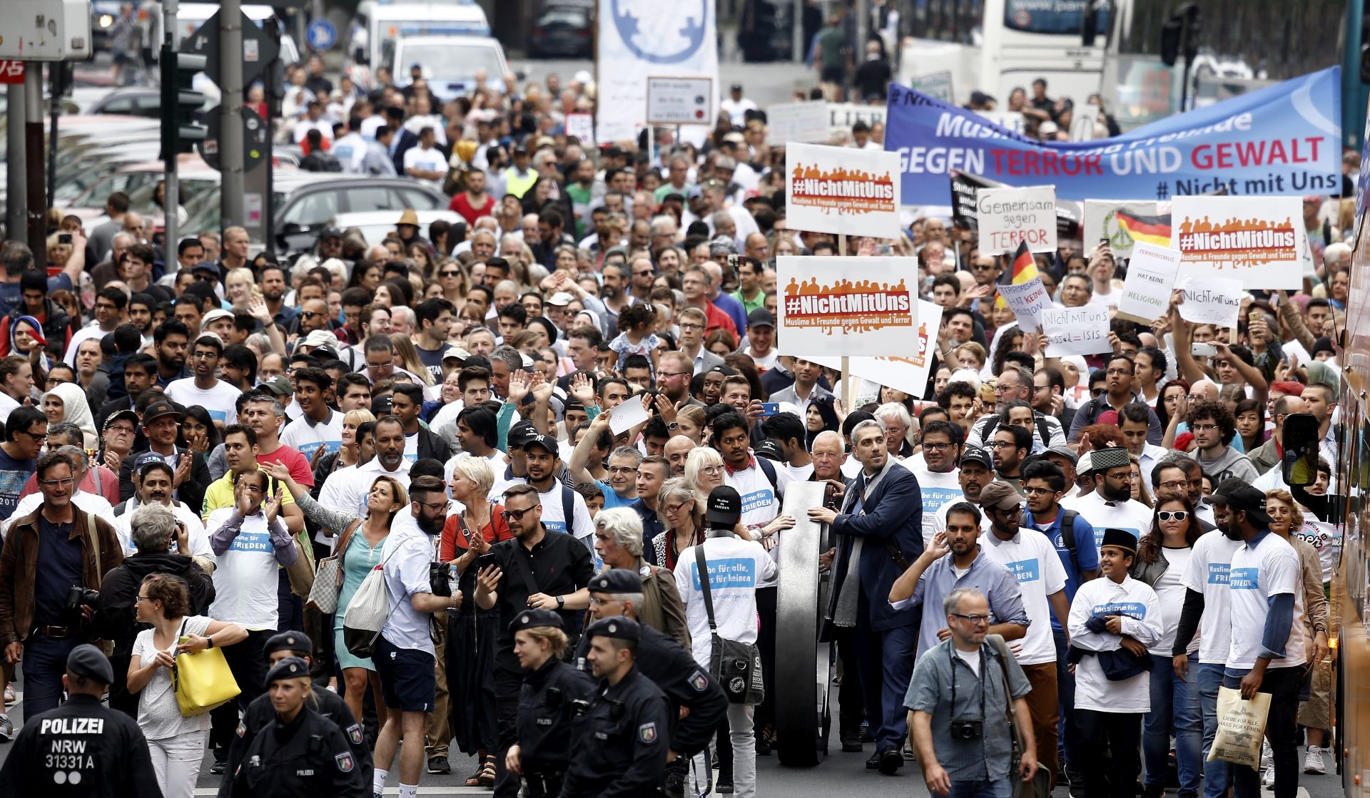 epa06033761 Hundrets of Muslims take part in 'The Not With Us' rally against the extremism in Cologne, Germany, 17 June 2017. The rally is to protest against Islamic terror following recent terror attacks in United Kingdom. About 40 organizations and associations as well as 260 individuals, including politicians and academics, gave their support except one of the largest Muslim associations in Germany Turkish-Islamic Union for Religious Affairs (DITIB), who has refused to take part, according to reports.  EPA/SASCHA STEINBACH