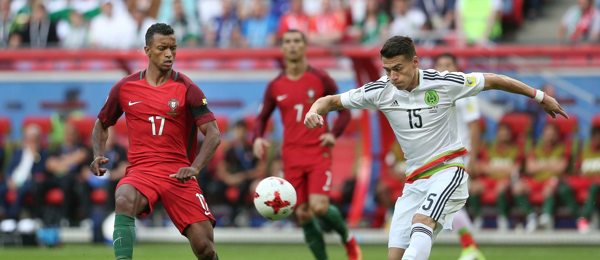 epa06035445 Portugal's Nani (L) in action against Mexico's Hector Moreno (R) during the FIFA Confederations Cup Group A match at Kazan Arena, in Kazan, Russia, 18 June 2017.  EPA/MARIO CRUZ