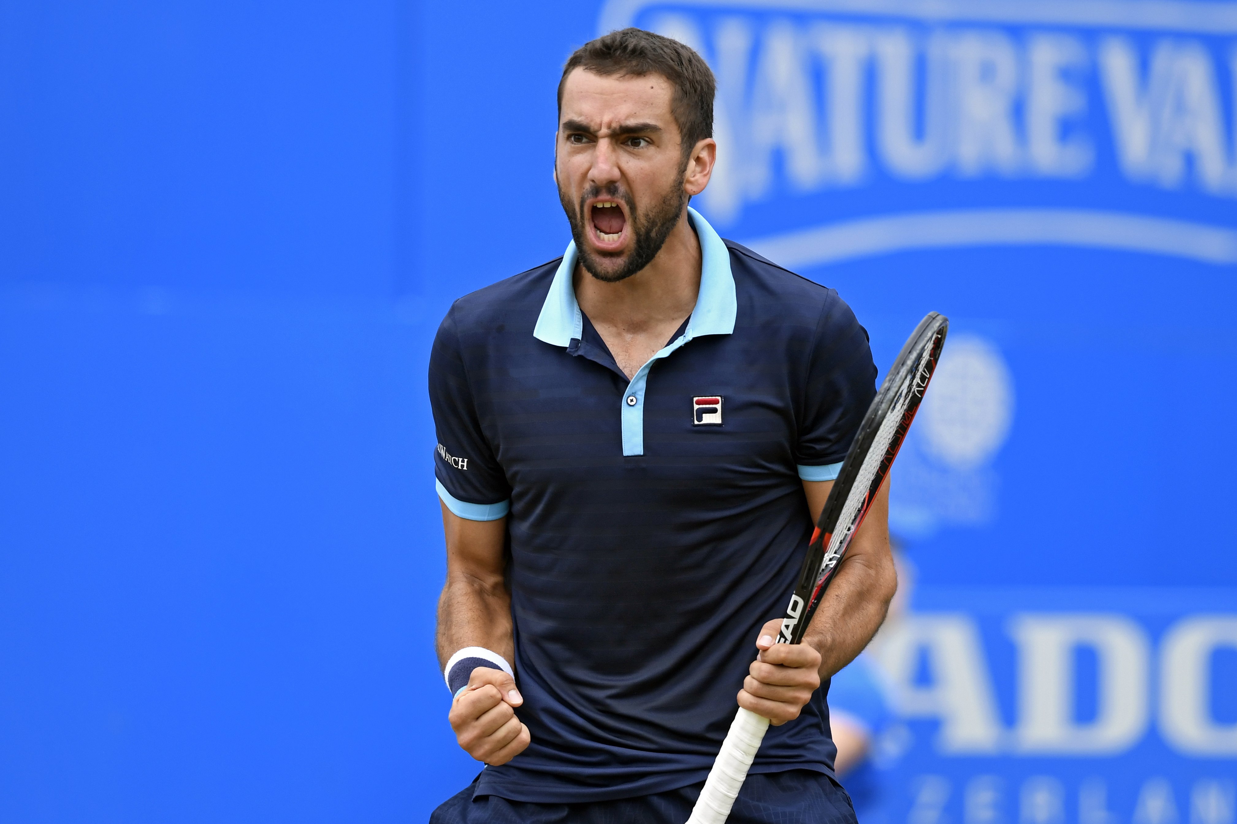 epa06047772 Marin Cilic of Croatia reacts during his semi final tennis match against Gilles Muller of Luxembourg at the Aegon tennis championships at the Queens Club in London, Britain, 24 June 2017.  EPA/WILL OLIVER
