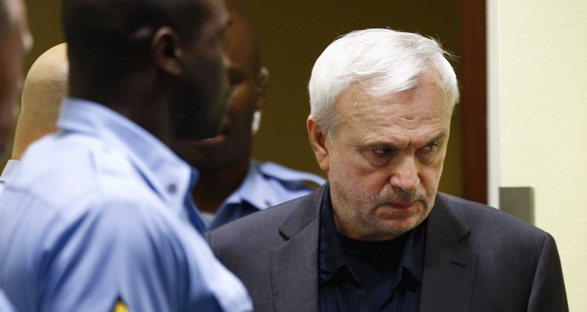 epa06025864 Former Serbian state security official Jovica Stanisic, also known as Frenki (R), appears in court for his retrial at the United Nations Mechanism for International Criminal Tribunals in The Hague, Netherlands, 13 June 2017. Stanisic, and fellow former state security official Franko Simatovic, are charged with committing crimes against Croats and Bosniaks during the wars in Croatia and Bosnia and Herzegovina from 1991 to 1995.  EPA/Michael Kooren / REUTERS POOL