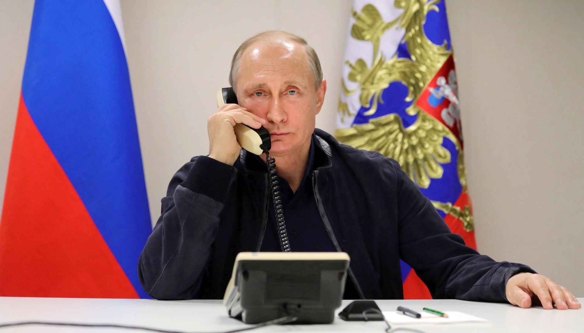 epa06045612 Russian President Vladimir Putin speaks with Turkish President Tayyip Erdogan during telephone conversation while inspecting the pipe-laying vessel Pionering Spirit in Anapa, Russia, 23 June 2017. Vladimir Putin inspected the work of laying the Turkish Stream gas pipeline in the Black Sea near Anapa.  EPA/MIKHAIL METZEL/SPUTNIK/KREMLIN POOL