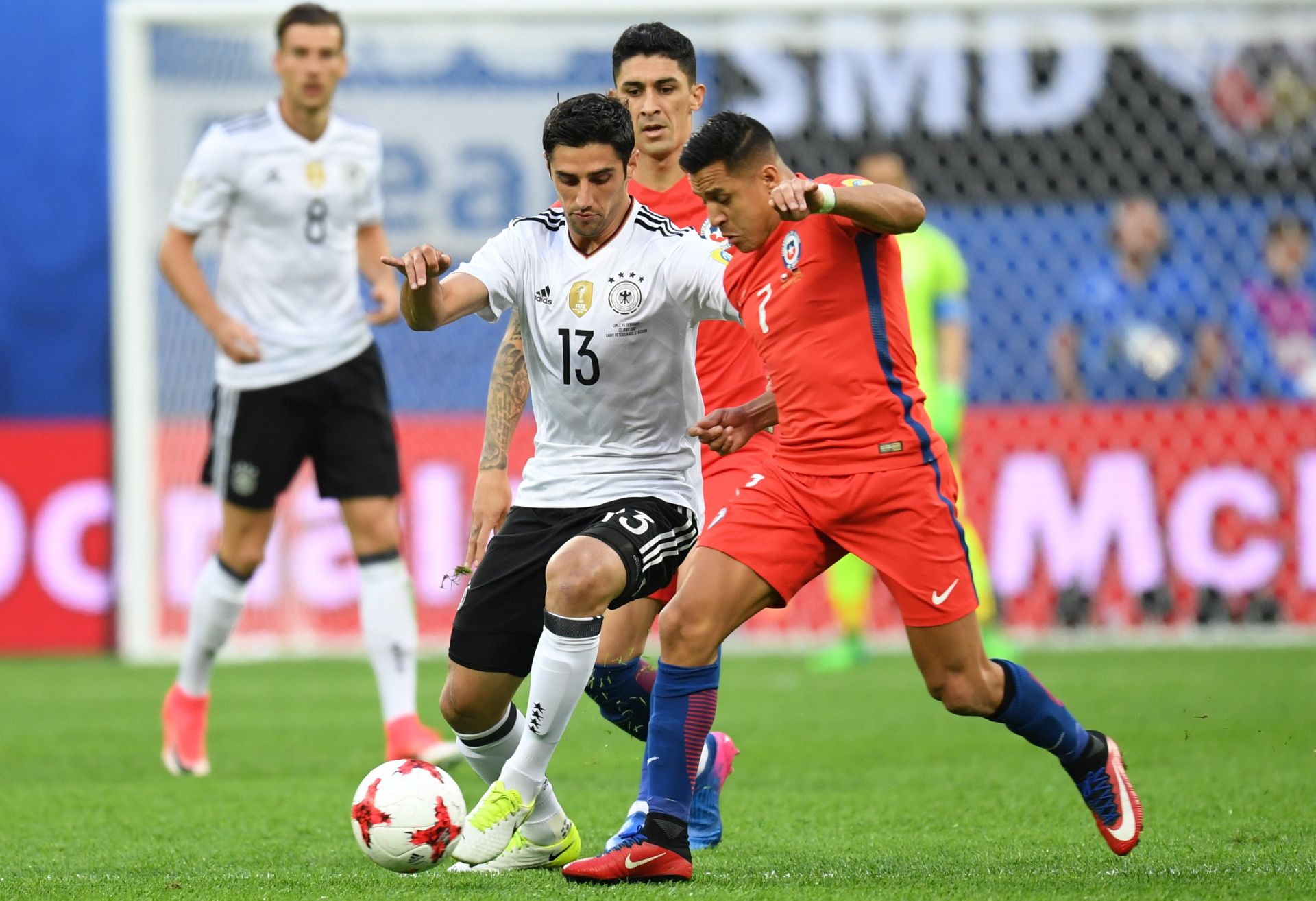 epa06062229 Chile's Alexis Sanchez (R) in action against Germany's Lars Stindl (C) during the FIFA Confederations Cup 2017 final match between Chile and Germany at the Saint Petersburg stadium in St.Petersburg, Russia, 02 July 2017.  EPA/GEORGI LICOVSKI