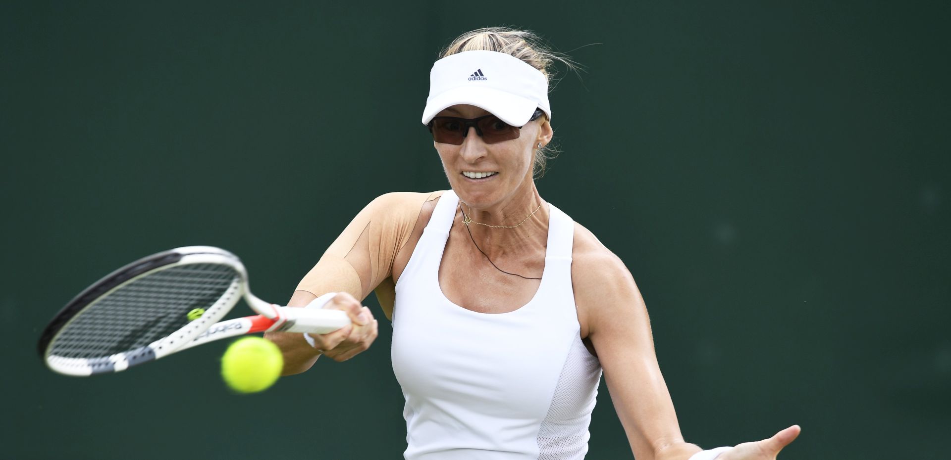 epa06063507 Mirjana Lucic-Baroni of Croatia returns to Carina Witthoeft of Germany in their first round match during the Wimbledon Championships at the All England Lawn Tennis Club, in London, Britain, 03 July 2017.  EPA/WILL OLIVER EDITORIAL USE ONLY/NO COMMERCIAL SALES