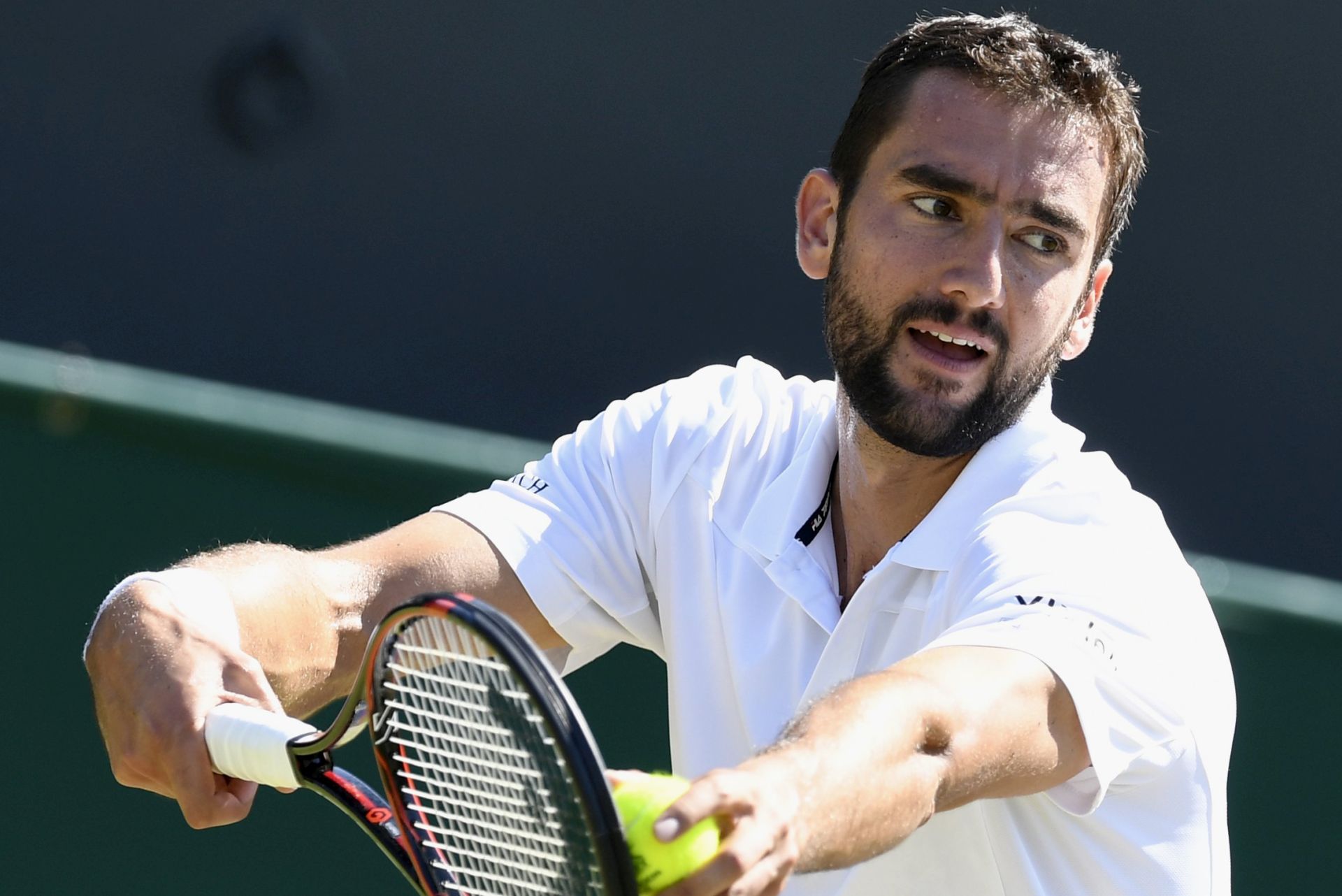 epa06067755 Marin Cilic of Croatia in action against Florian Mayer of Germany during their second round match for the Wimbledon Championships at the All England Lawn Tennis Club, in London, Britain, 05 July 2017.  EPA/WILL OLIVER EDITORIAL USE ONLY/NO COMMERCIAL SALES