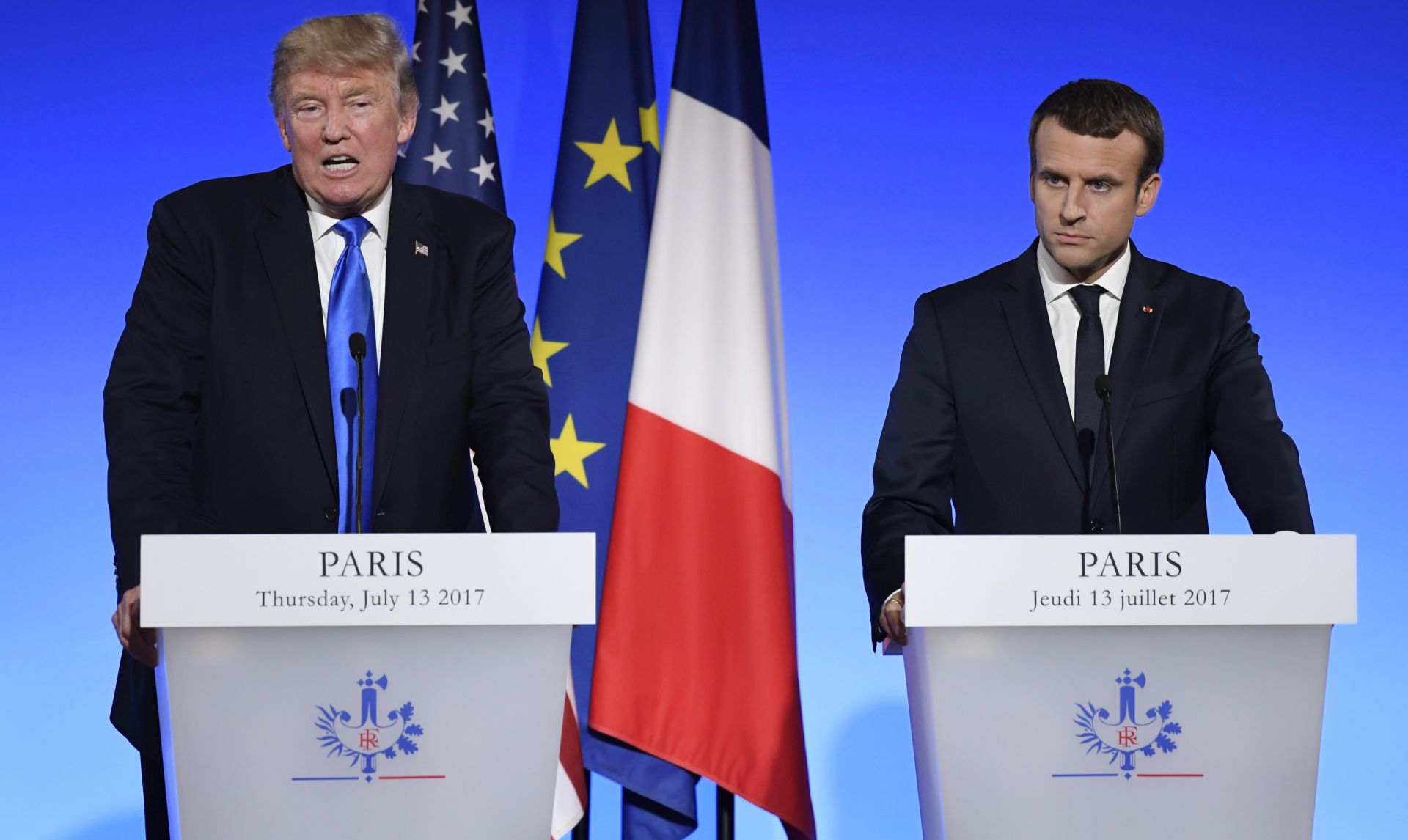 epa06085691 US President Donald J. Trump and French President Emmanuel Macron speak at a joint news conference at the Elysee Palace in Paris, France, 13 July 2017. US President Trump earlier arrived for an official visit to Paris.  EPA/JULIEN DE ROSA