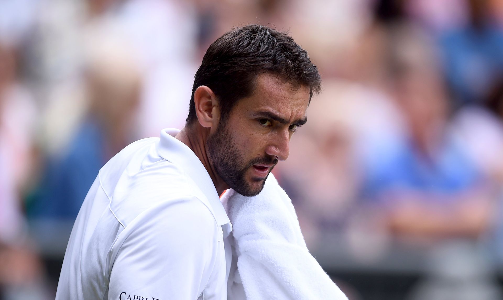 epa06086873 Marin Cilic of Croatia in action against Sam Querrey of the USA during their semi final match for the Wimbledon Championships at the All England Lawn Tennis Club, in London, Britain, 14 July 2017.  EPA/GERRY PENNY EDITORIAL USE ONLY/NO COMMERCIAL SALES