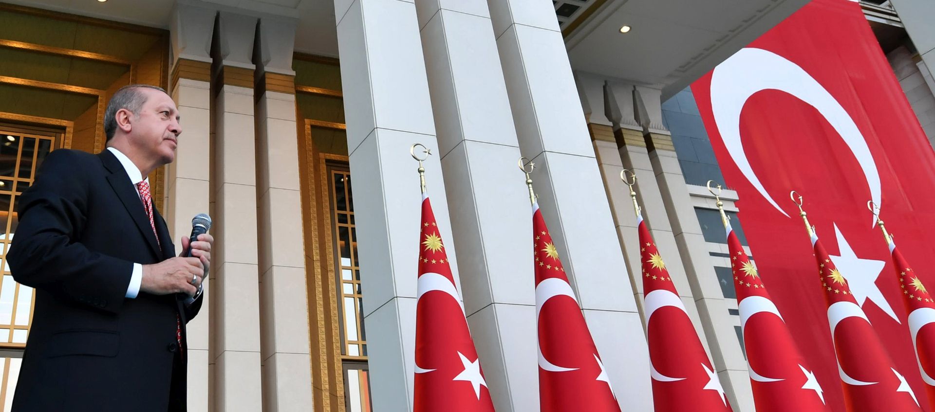 epa06090519 A handout photo made available by the Presidential Press Office shows Turkish President Recep Tayyip Erdogan speaking during a ceremony to mark the first anniversary of the failed Coup attempt on 15 July, in front of the new monument of martyrs at Presidential Palace in Ankara, Turkey early 16 July 2017. The 15 July 2017 events marked the first anniversary of the failed coup attempt which led to some 50 thousand workers being dismissed, some eight thousand people arrested, and scores of news outlets shut down by the government. Turkish President Recep Tayyip Erdogan blamed US-based Turkish cleric Fetullah Gulen and his movement for masterminding the failed coup and Turkey remains under a state of emergency as a result.  EPA/PRESIDENTIAL PRESS OFFICE HANDOUT  HANDOUT EDITORIAL USE ONLY/NO SALES