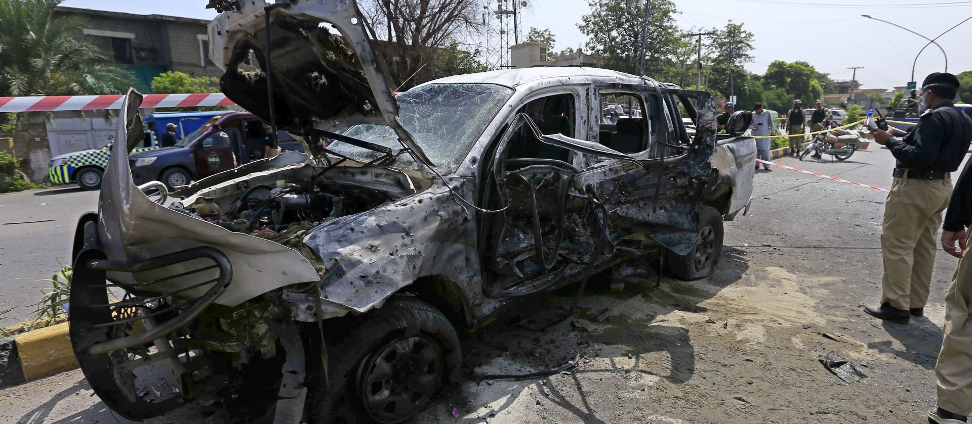 epa06092324 Pakistani security officials inspect the scene of a suicide bomb attack in Peshawar, Pakistan, 17 July 2017. A suicide bomber detonated explosives strapped to his body near a paramilitary Frontier Corps vehicle, killing an FC Major and a soldier, while injuring 10 others inlcluding four soldiers, according to reports. The suicide attack occurred a day after Inter Services Public Relations Director General Major General Asif Ghafoor announced the launching of another military operation, Khyber-IV, to counter the growing influence of IS in Rajgal valley of Khyber Agency, the tribal area adjoining the Hayatabad area of Peshawar.  EPA/ARSHAD ARBAB