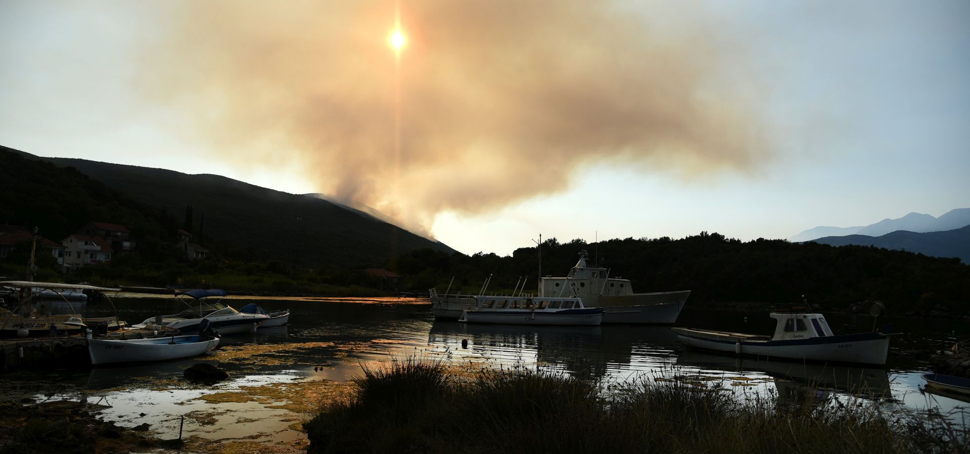 epa06095298 A view of smoke from a forest fire in the Lustica Peninsula near Tivat, Montenegro 18. July.2017. Montenegrin firemen are trying to get the upper hand on wildfires that have damaged and destroyed some homes in villages around the city of Tivat, along the Adriatic Coast.  EPA/BORIS PEJOVIC EPA