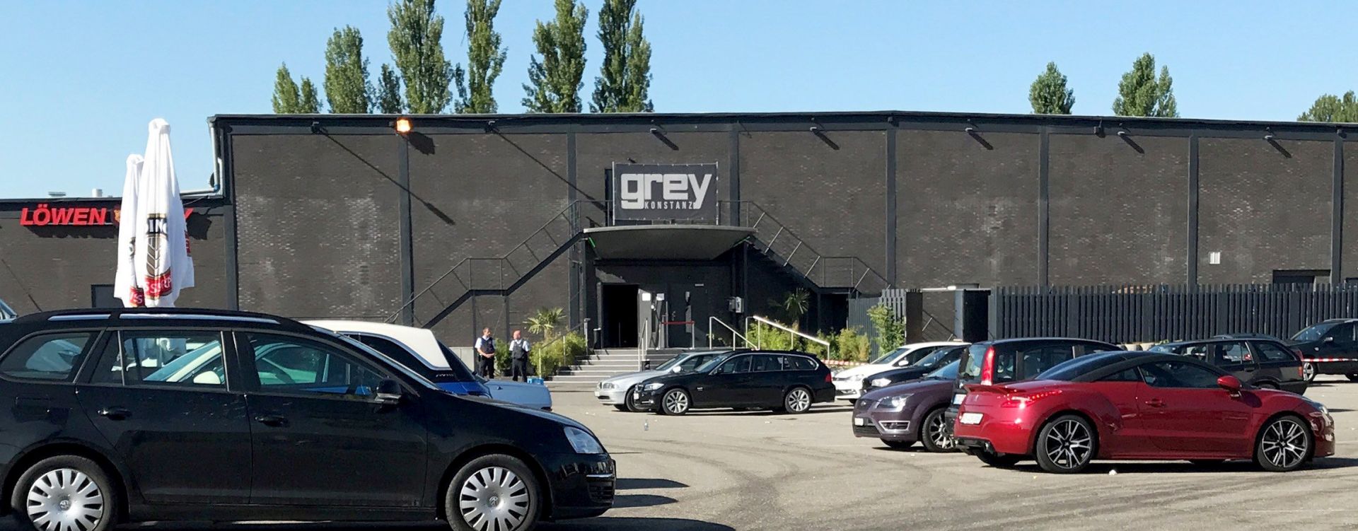epa06117057 Police officers stand at the door of the night club 'Grey' in Konstanz, Germany, 30 July 2017. According to a police report a 34-year-old man shot at several people inside the club in the early morning. One victim was killed, tree were heavily injured. While leaving the club the shooter was gunned down by police, one police officer was hit by a bullet but is not in danger to life. The suspect died later in hospital.  EPA/OLIVER HANSER