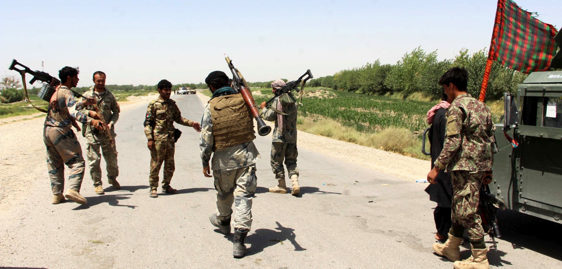 epa06091036 Afghan security officials patrol in Nawa district restive Helmand province, Afghanistan, 16 July 2017. Afghan security officials search an area after heavy gunbattles with Taliban in Nawa district, of Helmand province. Afghan security forces are engaged in an operation against Taliban militants who have continued to launch massive attacks in Helmand province for the last few weeks.  EPA/WATAN YAR