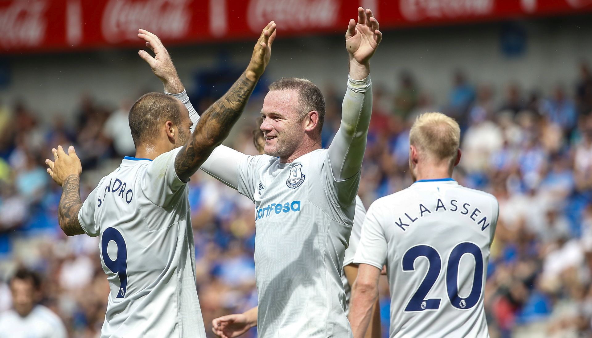 epa06103547 Everton's Wayne Rooney (C) celebrates with Everton's Sandro Ramirez (L) during a friendly soccer match between KRC Genk vs FC Everton at Crystal Arena Stadium in Genk, Belgium, 22 July 2017.  EPA/JULIEN WARNAND