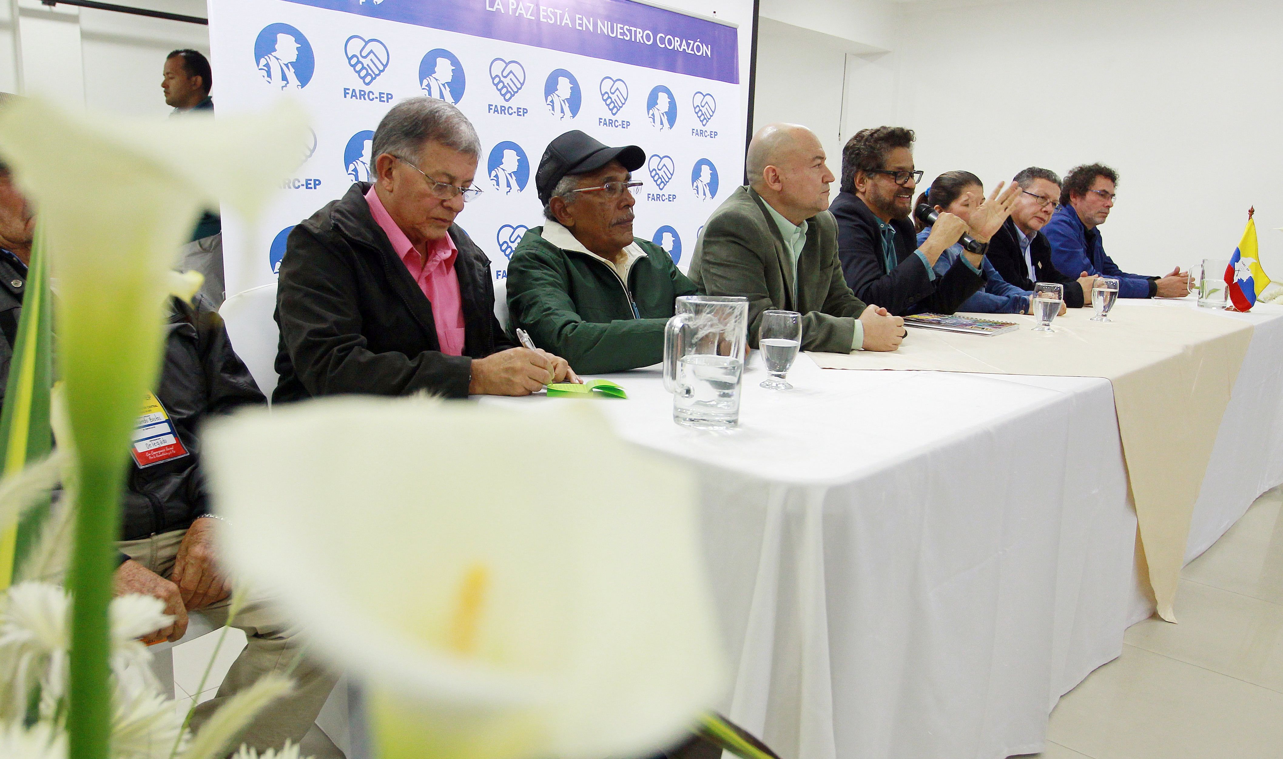 epa06113784 The members of the Revolutionary Armed Forces of Colombia's (FARC) Secretariat (L-R) Ricardo Tellez, Joaquin Gomez, Carlos Antonio Lozada, Ivan Marquez, Sandra Ramirez, Pablo Catatumbo and Pastor Alape speak with the media in Bogota, Colombia, 27 July 2017. The FARC invited all Colombian presidential candidates to the founding congress they will hold in August to become a political party, a transition that will conclude on 01 September.  EPA/MAURICIO DUENAS CASTANEDA