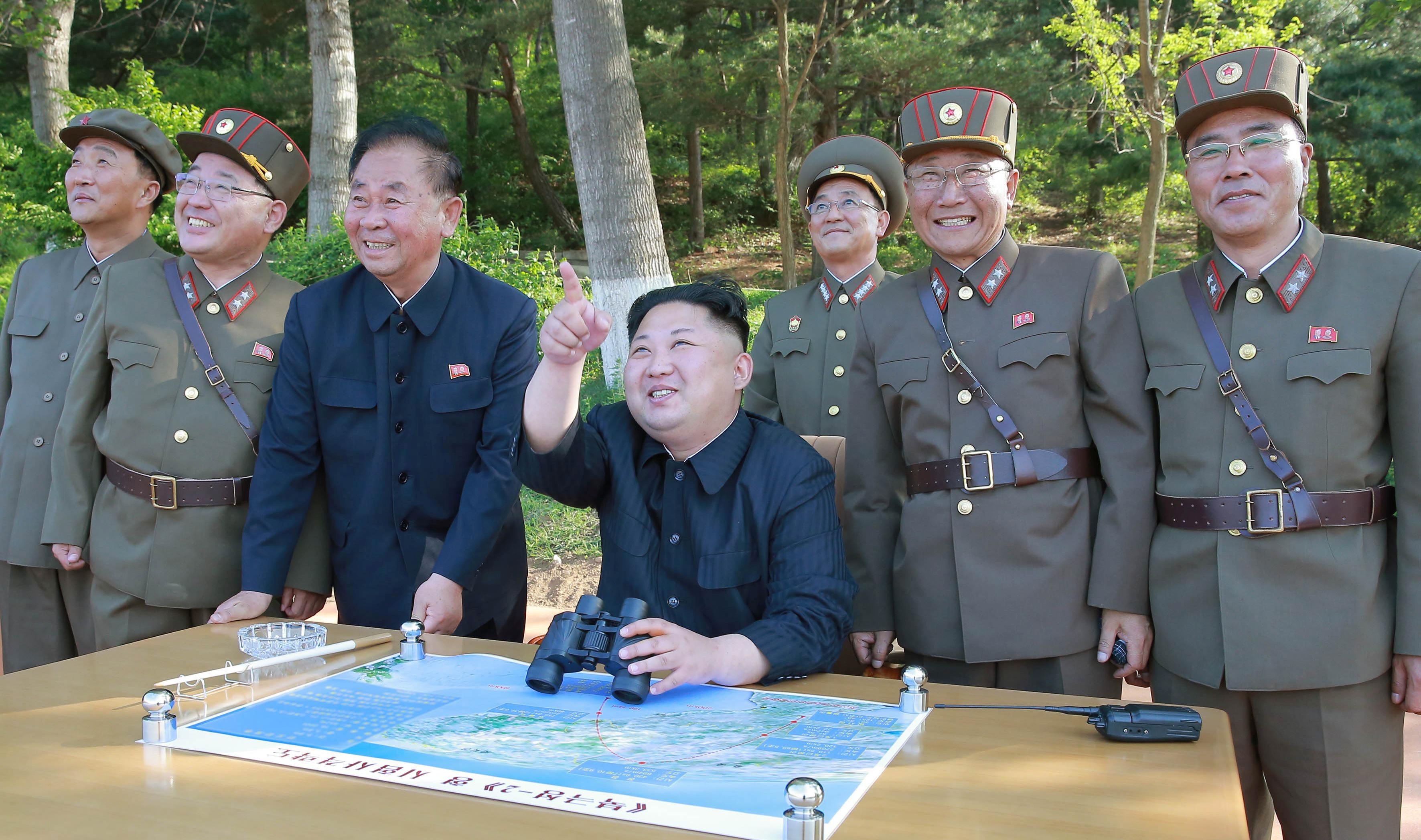 epa06115683 (FILE) - An undated photo made available by the North Korean Central News Agency (KCNA), the state news agency of North Korea, shows North Korean Supreme Leader Kim Jong-un (C) supervising the test-fire of a ground-to-ground medium-to-long range strategic ballistic missile Pukguksong-2 at an undisclosed location in North Korea (reissued 29 July 2017). According to South Korea's Joint Chiefs of Staff, North Korea has test-fired a ballistic missile into the East Sea on 28 July 2017, from the North's Jagang Province. North Korean leader Kim Jong-un hailed the latest intercontinental ballistic missile test as a success claiming he could strike the entire continental US, state media reported.  EPA/KCNA   EDITORIAL USE ONLY
