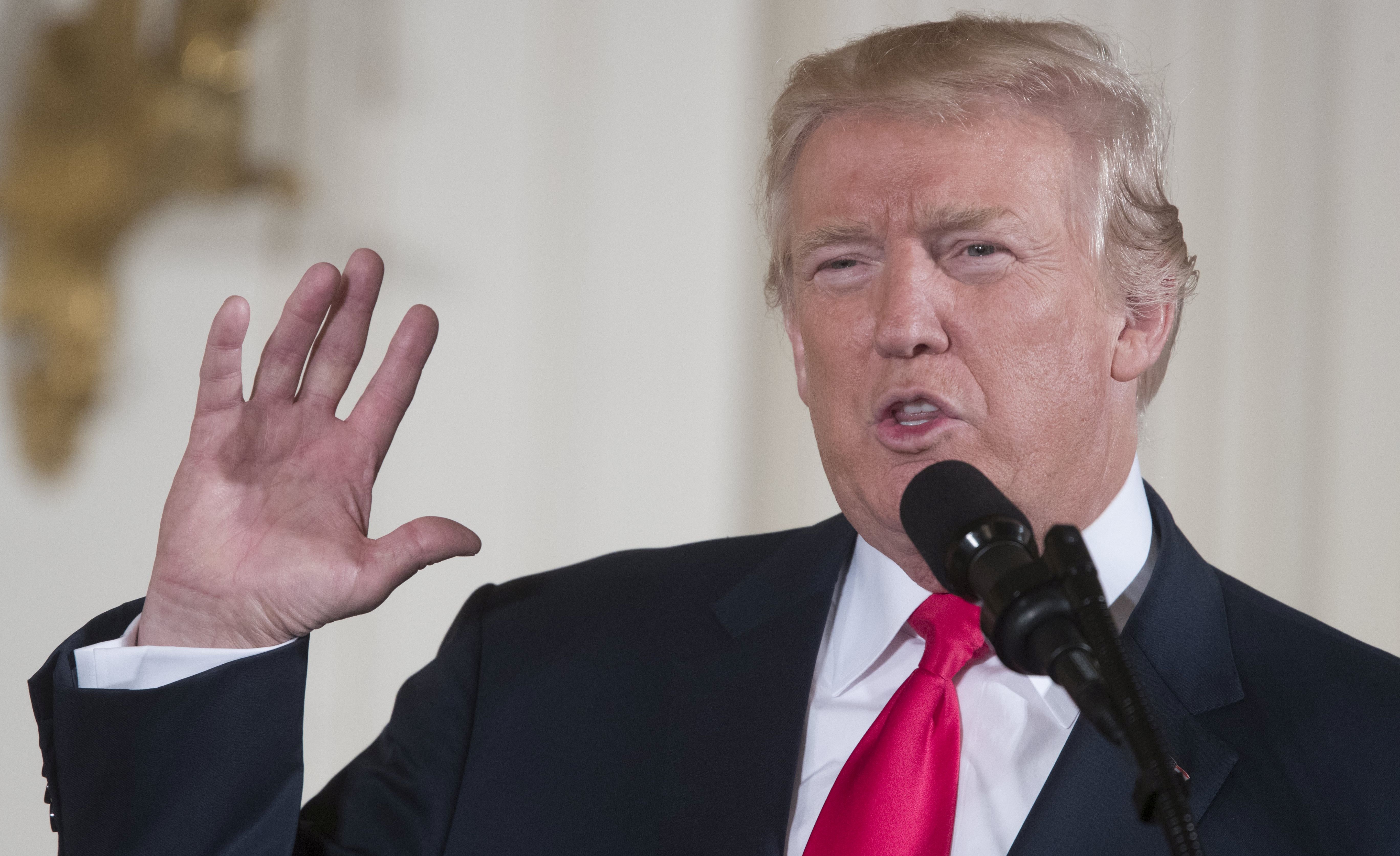 epa06119223 US President Donald J. Trump delivers remarks before awarding the Medal of Honor to former US Army medic and Vietnam War veteran James McCloughan (not pictured), during a ceremony in the East Room of the White House in Washington, DC, USA, 31 July 2017. McCloughan is awarded the first Medal of Honor by President Trump for actions McCloughan made that saved the lives of numerous members of his platoon while serving as a Private First Class in May, 1969.  EPA/MICHAEL REYNOLDS