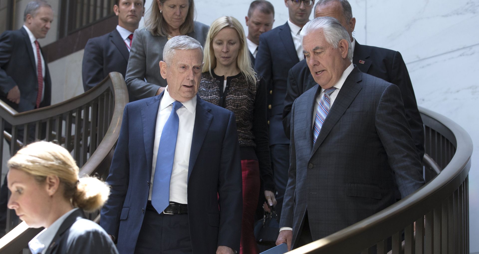 epa06121811 US Secretary of Defense James Mattis (C-L) and US Secretary of State Rex Tillerson (C-R) walk to the Senate Foreign Relations Committee closed briefing entitled 'Authorizations for the Use of Military Force - Administration Perspective', on Capitol Hill in Washington, DC, USA, 02 August 2017.  EPA/MICHAEL REYNOLDS