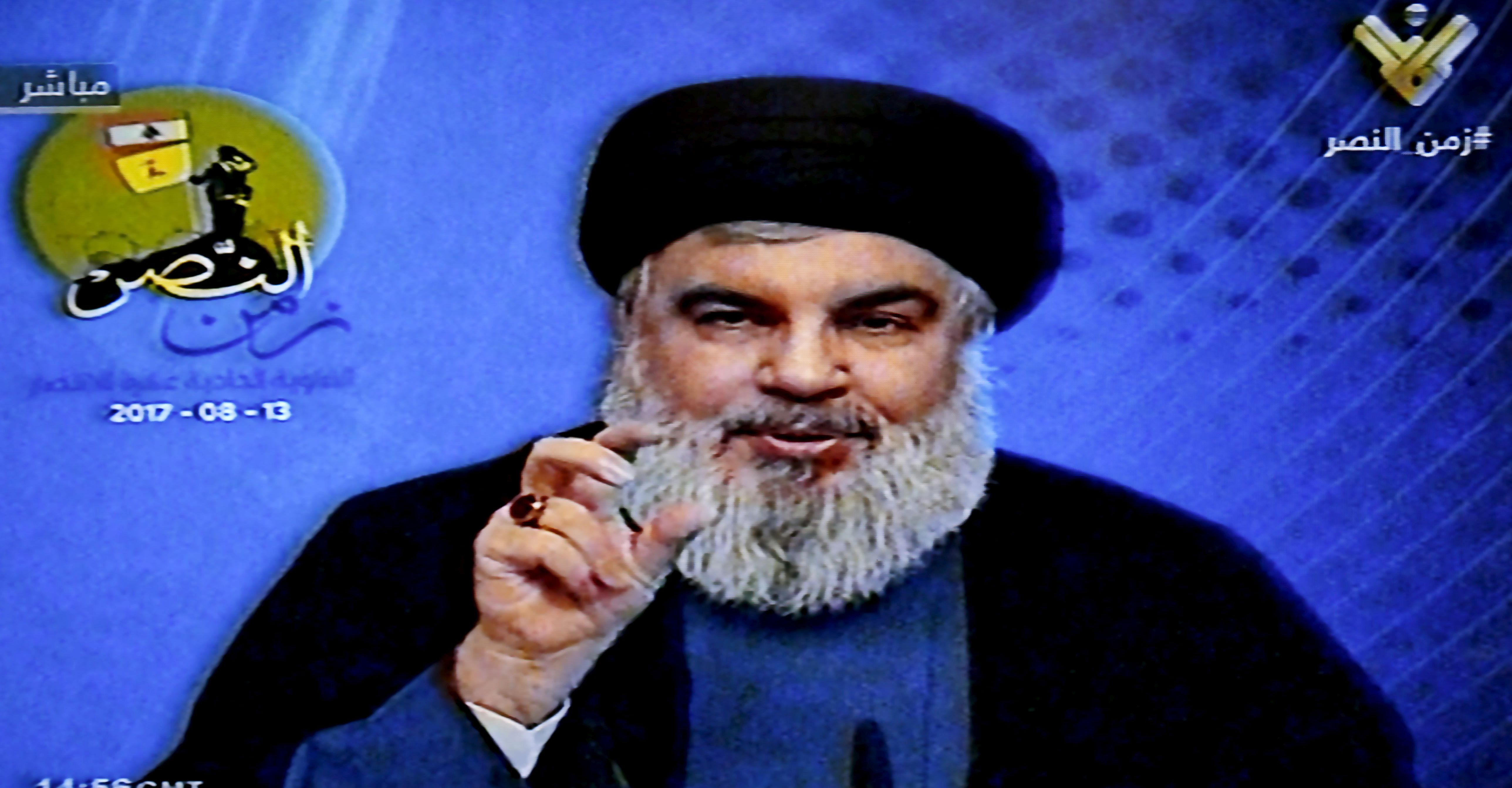 epa06142469 A grab picture from Hezbollah's al-Manar TV shows Hezbollah leader Sayyed Hassan Nasrallah giving a speech from an undisclosed location in Al Khyam town in south Lebanon, 13 August 2017, during a rally to mark the 11th anniversary of the end of the 2006 war with Israel.  EPA/AL-MANAR TV GRAB HANDOUT  HANDOUT EDITORIAL USE ONLY/NO SALES