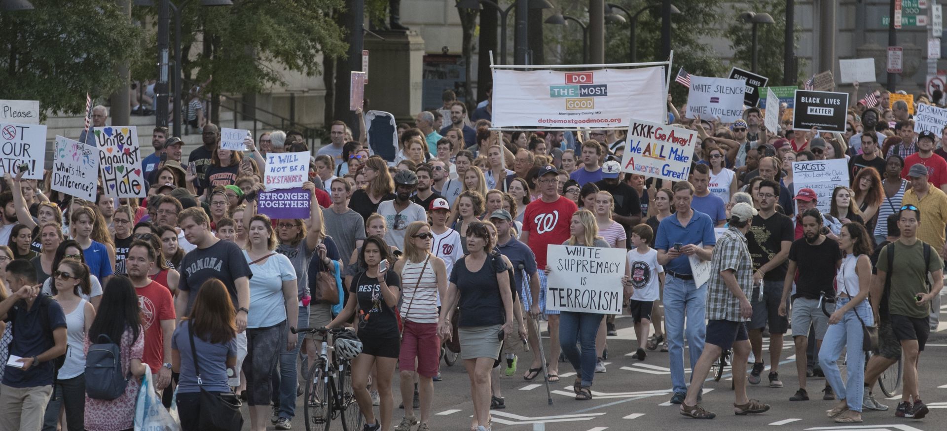 epa06143520 People march down Pennsylvania Avenue during a rally held to demonstrate against the violence that took place this weekend at a white nationalist rally in Charlottesville, Virginia; in Washington, DC, USA, 13 August 2017. Rallies have been planned across the United States to demonstrate opposition to the violence in Charlottesville. According to media reports at least one person was killed and 19 injured after a car hit a crowd of people counter-protesting the 'Unite the Right' rally which was scheduled to take place in Charlottesville on 12 August. At least 15 others were injured in clashes during protests.  EPA/MICHAEL REYNOLDS