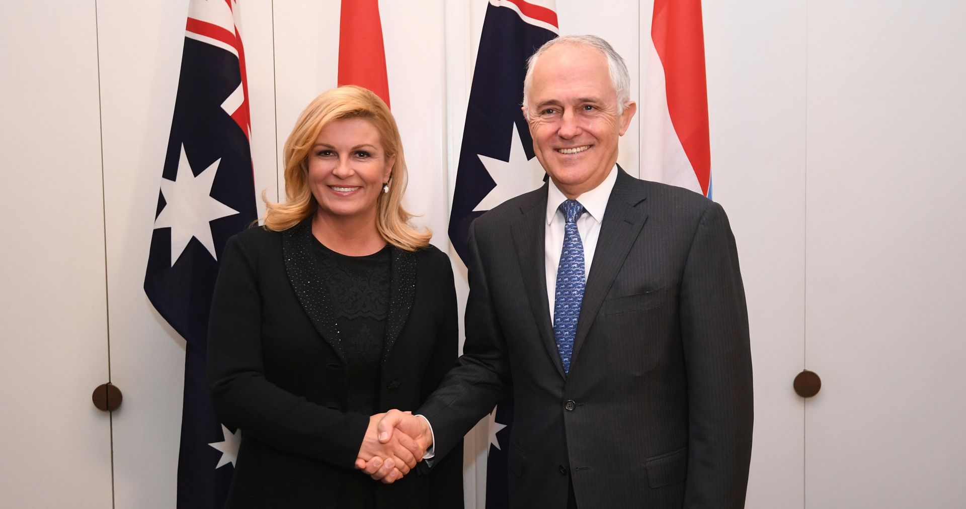 epa06146635 Croatian President Kolinda Grabar-Kitarovic (L) shakes hands with Australian Prime Minister Malcolm Turnbull ahead of a bilateral meeting at Parliament House in Canberra, Australian Capital Territory, Australia, 16 August 2017.  EPA/LUKAS COCH  AUSTRALIA AND NEW ZEALAND OUT