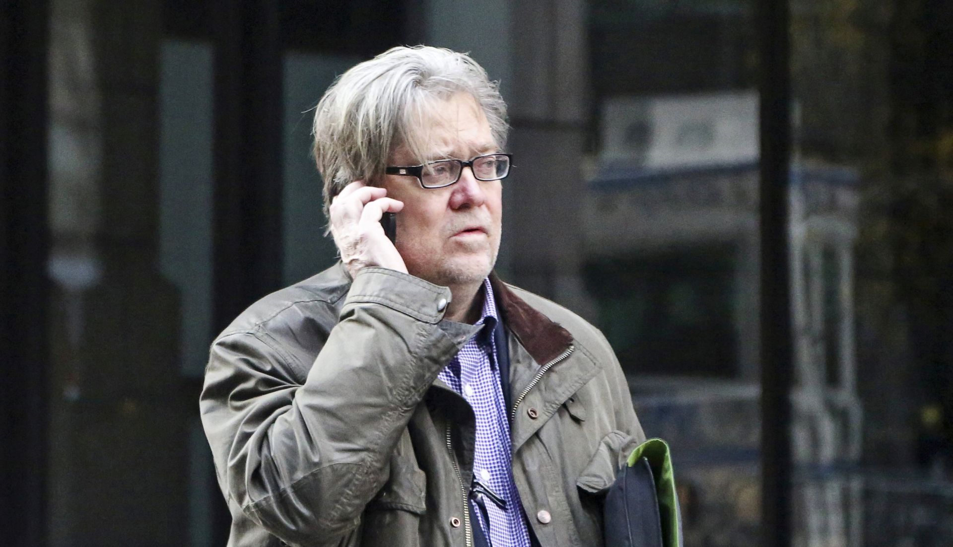 epa06150304 (FILE) - Chief political strategist and senior counselor for US President-elect Donald Trump, Steve Bannon, makes a phone call outside Trump Tower, in New York, New York, USA, 09 December 2016 (reissued 18 August 2017). According to media reports on 18 August 2017, Bannon no longer serves as White House Chief Strategist for US President Donald J. Trump.  EPA/Aude Guerrucci  / POOL