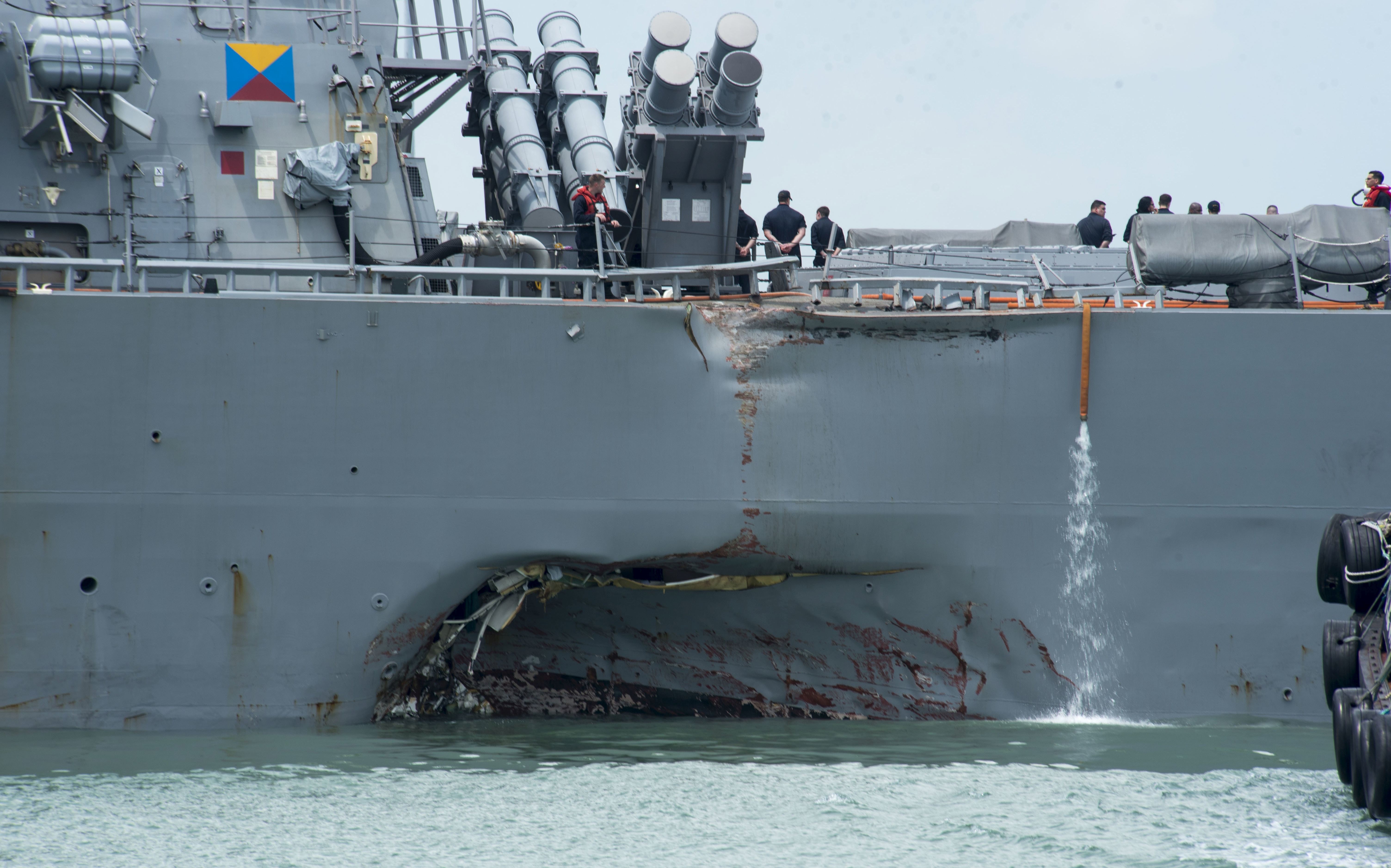 epa06154673 A handout photo made available by the United States Navy 7th Fleet shows the damaged hull on the port side of the United States Navy missile destroyer USS John S. McCain while berthed at the Changi Navy Base in Singapore, 21 August 2017. According to media reports, ten US Navy sailors are missing and five were injured after the guided-missile destroyer USS John S. McCain collided with the Liberian-flagged oil tanker Alnic MC off the coast between Singapore and Malaysia.  EPA/UNITED STATES NAVY 7TH FLEET/ HANDOUT  HANDOUT EDITORIAL USE ONLY/NO SALES