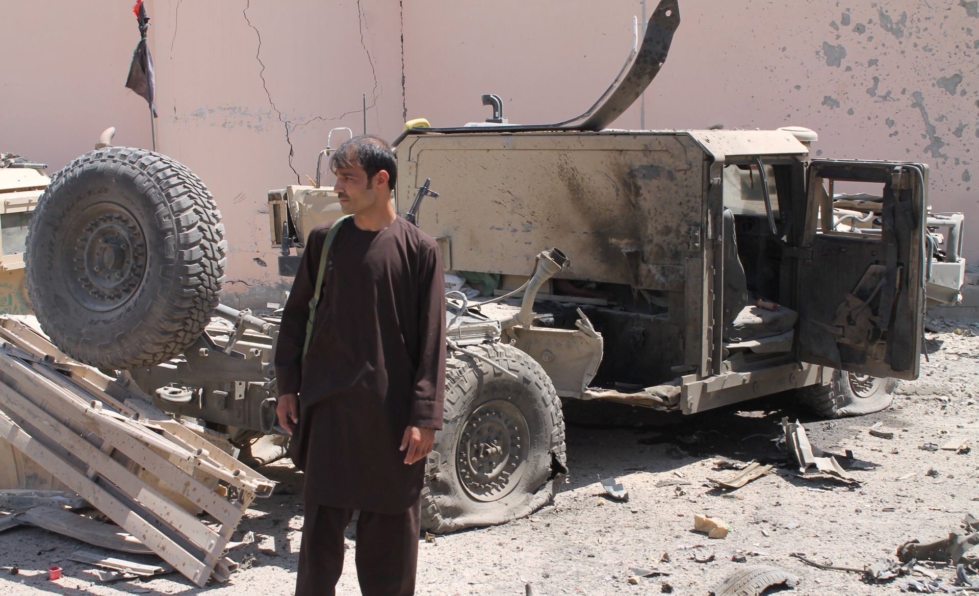 epa06157267 Afghan security officials inspect the scene of a suicide bomb attack near Police barracks, that killed at least 10 people mostly civilians, in Lashkar Gah, Helmand province, Afghanistan, 23 August 2017. The attack comes a day after President of the United States Donald Trump announced an open-ended expansion of its involvement in the Afghan conflict, including raising troop deployment. According to a report by the US Special Inspector General for Afghanistan Reconstruction earlier in the month, the war in Afghanistan has been stagnant with insurgents controlling 40 percent of the country.  EPA/STRINGER