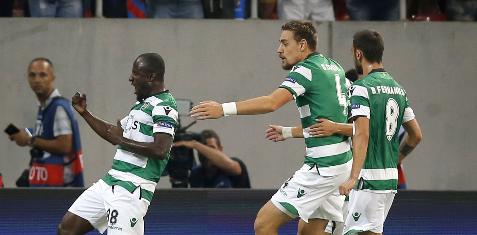 epa06158574 Sporting's Seydou Doumbia (L) celebrates with his teammates Sebastian Coates (C) and Bruno Fernandes (R) after scoring a goal during the UEFA Champions League playoff, 2nd leg soccer match between FC Steaua Bucharest and Sporting CP in Bucharest, Romania, 23 August 2017.  EPA/ROBERT GHEMENT