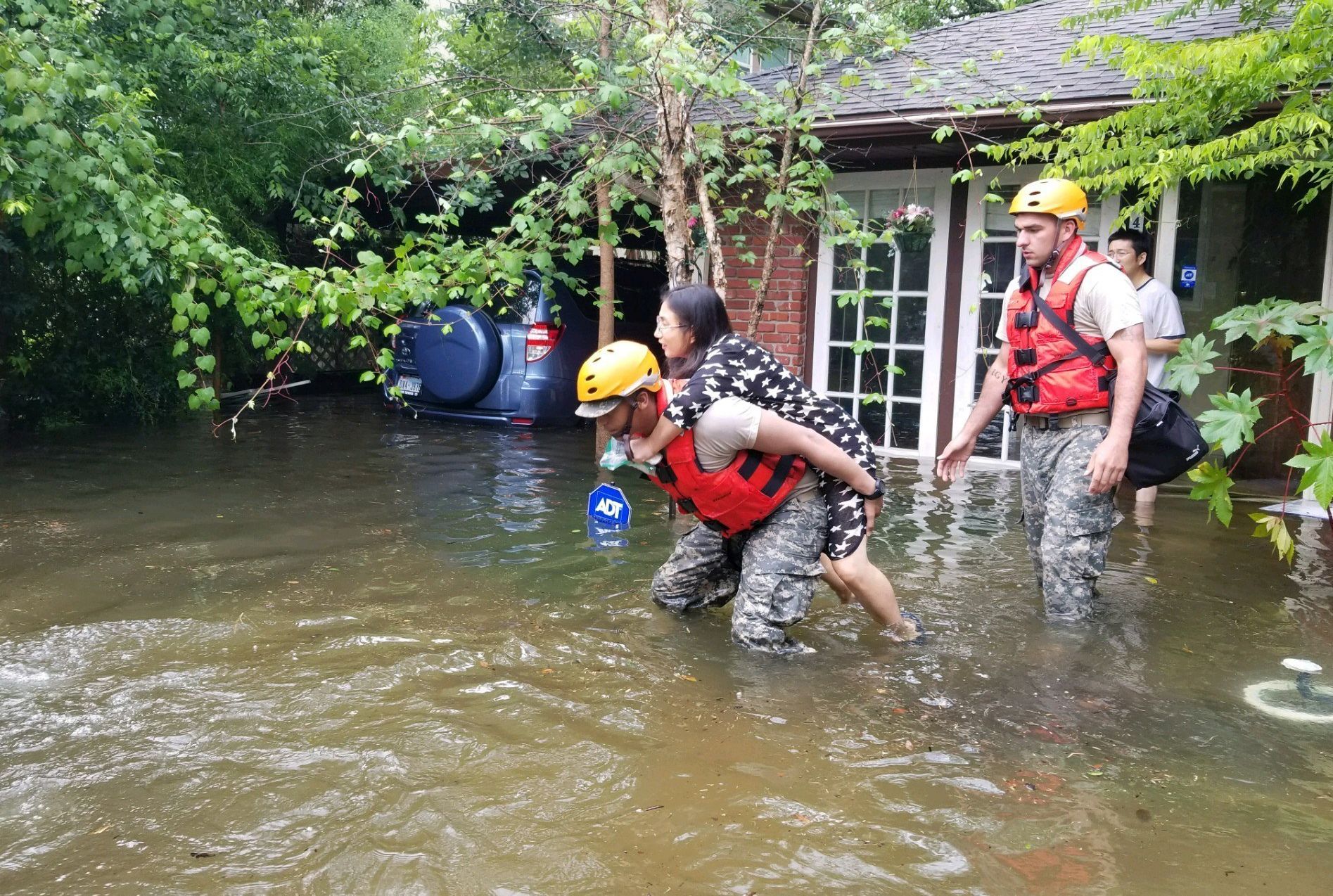 epa06167845 A handout photo made available by the Texas Military Department shows Texas National Guard soldiers arriving to aid citizens in heavily flooded areas from the storms of Hurricane Harvey in Houston, Texas, USA, 27 August 2017 (issued 28 August 2017). The areas in and around Houston and south Texas are experiencing record floods after more than 24 inches of rain after Harvey made landfall in the south coast of Texas as a category 4 hurricane, the most powerful to affect the US since 2004. Harvey has weakened and been downgraded to a tropical storm and is expected to cause heavy rain for several days.  EPA/LT. ZACHARY WEST, 100TH MPAD / HANDOUT  HANDOUT EDITORIAL USE ONLY/NO SALES