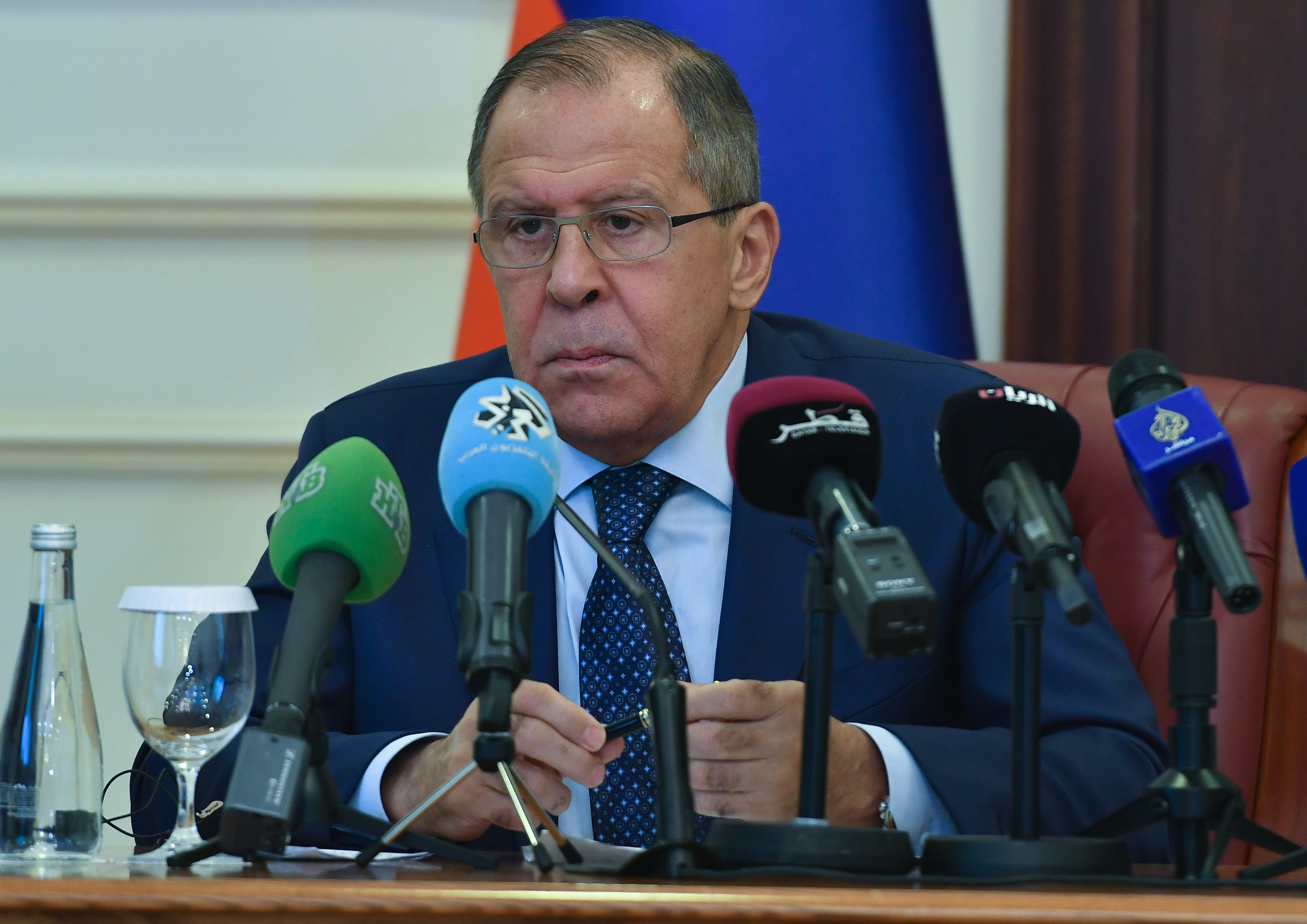 epa06171896 Russian Foreign Minister Sergei Lavrov speaks during a joint press conference with Qatari Foreign Minister Sheikh Mohammed bin Abdulrahman Al-Thani (not pictured) after their meeting at the ministry of foreign affairs in Doha- Qatar, 30 August 2017.  EPA/Noushad Thekkayil