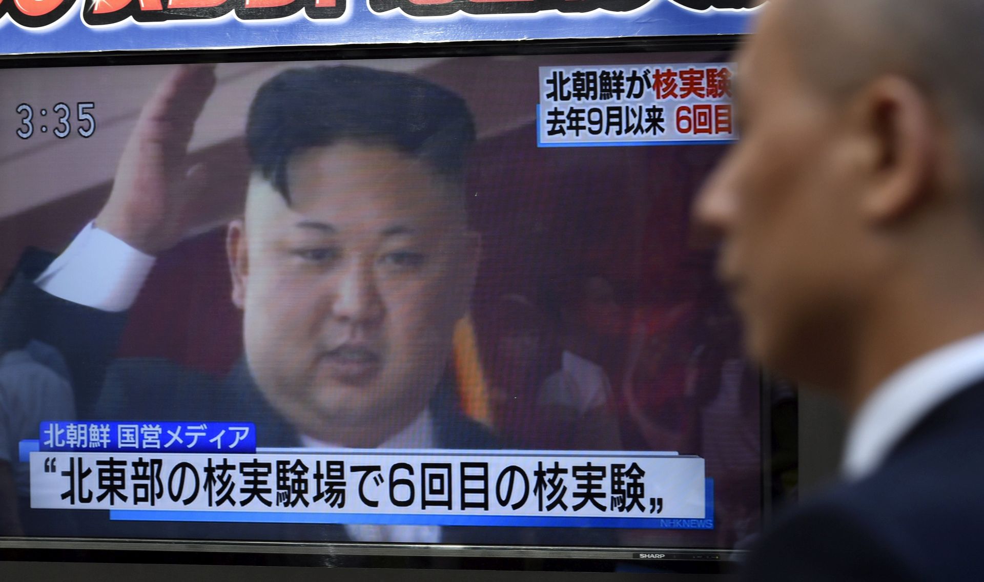 epa06180519 A pedestrian walks past a TV screen on a street displaying North Korean leader Kim Jong-un after North Korea proceeded to a nuclear test, in Tokyo, Japan, 03 September 2017. North Korea announced it has conducted to its sixth nuclear test by detonating a hydrogen bomb that can installed in an ICBM.  EPA/FRANCK ROBICHON