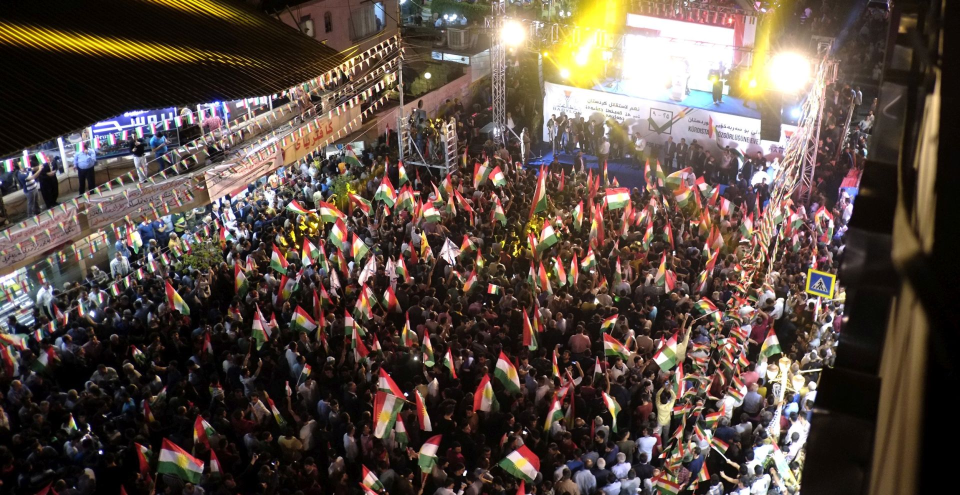 epa06193716 Kurdish men take part in a gatharing to support the upcoming independence referendum, at a street in Erbil city, northern Iraq, 08 September 2017 (Issued 09 September 2017). The Independent High Election and Referendum Commission of Kurdistan Region (IHERC) announced the beginning of the official campaign for the upcoming referendum on independence of the Kurdistan Region in Erbil. The Kurdistan Region has scheduled an independence referendum for 25 September 2017 to allow people in the region to determine their future, either remain as part of Iraq or declare independence.  EPA/GAILAN HAJI