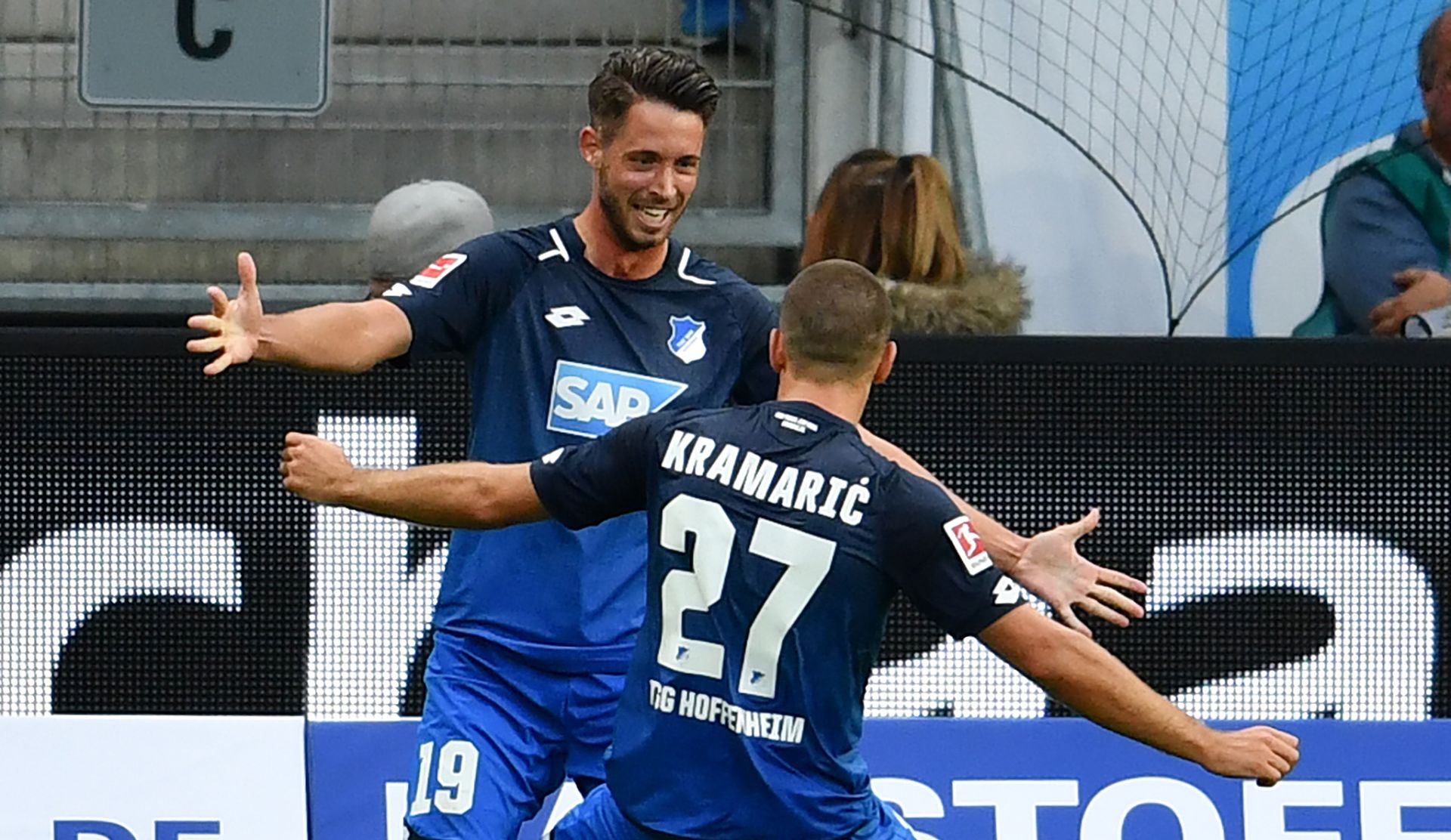 Hoffenheim's Mark Uth (l) celebrates his 1:0 goal with team colleague Andrej Kramaric  during the German Bundesliga soccer match between 1899 Hoffenheim and Bayern Munich at the Rhein-Neckar-Arena in Sinsheim, Germany, 9 September 2017.



(EMBARGO CONDITIONS - ATTENTION: Due to the accreditation guidlines, the DFL only permits the publication and utilisation of up to 15 pictures per match on the internet and in online media during the match.) Photo: Hasan Bratic/dpa