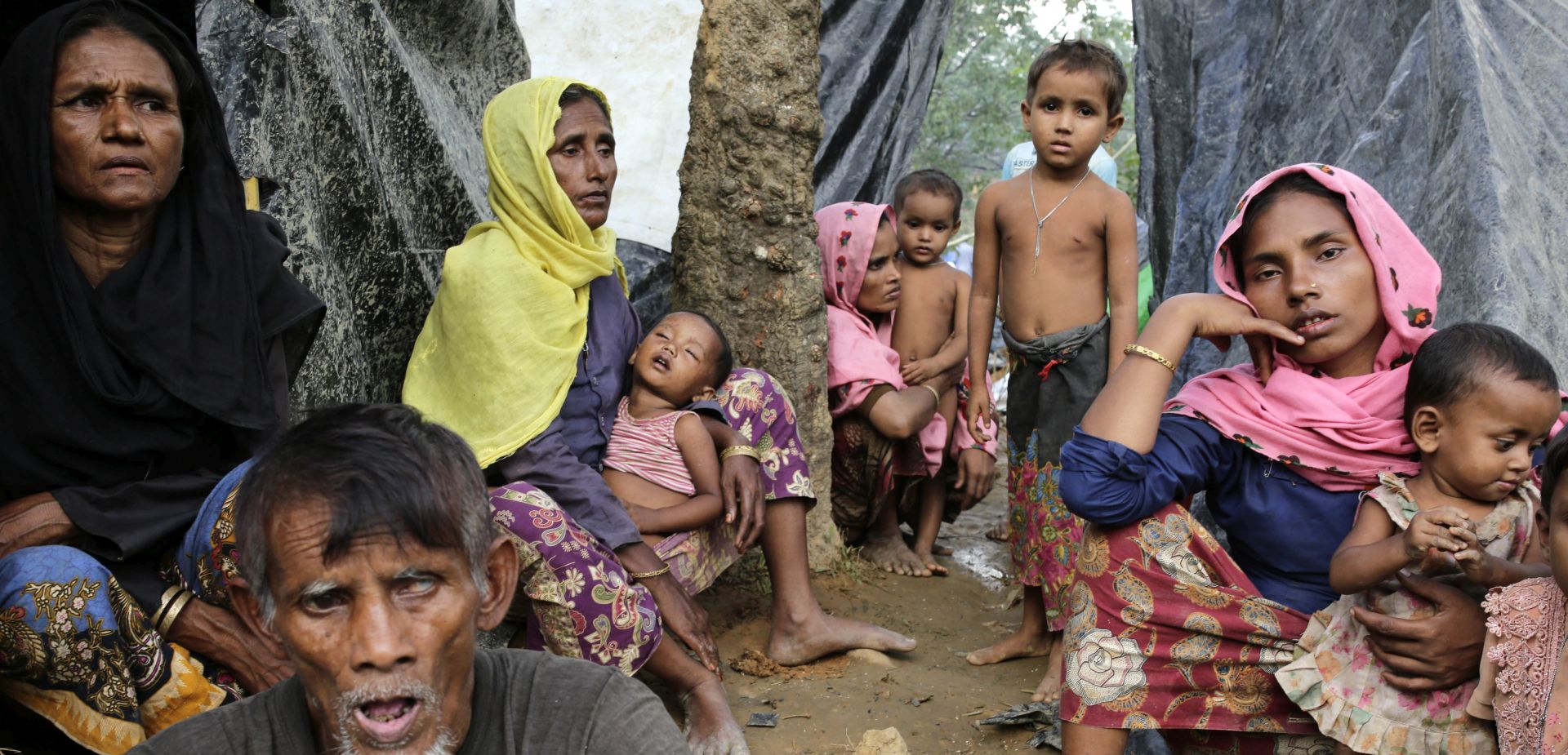 epa06198395 Rohingya women sit in front of their makeshift shelters in a camp in Ukhiya, Cox's Bazar, Bangladesh, 11 September 2017. Rohingya refugees experience huge problems to find shelters as they stay on the streets, inside small forest and in the newly built refugee camps. According to United Nations more than 270,000 Rohingya refugees have fled Myanmar from violence over the last few weeks, most trying to cross the border and reach Bangladesh. International organizations have reported claims of human rights violations and summary executions allegedly carried out by the Myanmar army.  EPA/ABIR ABDULLAH