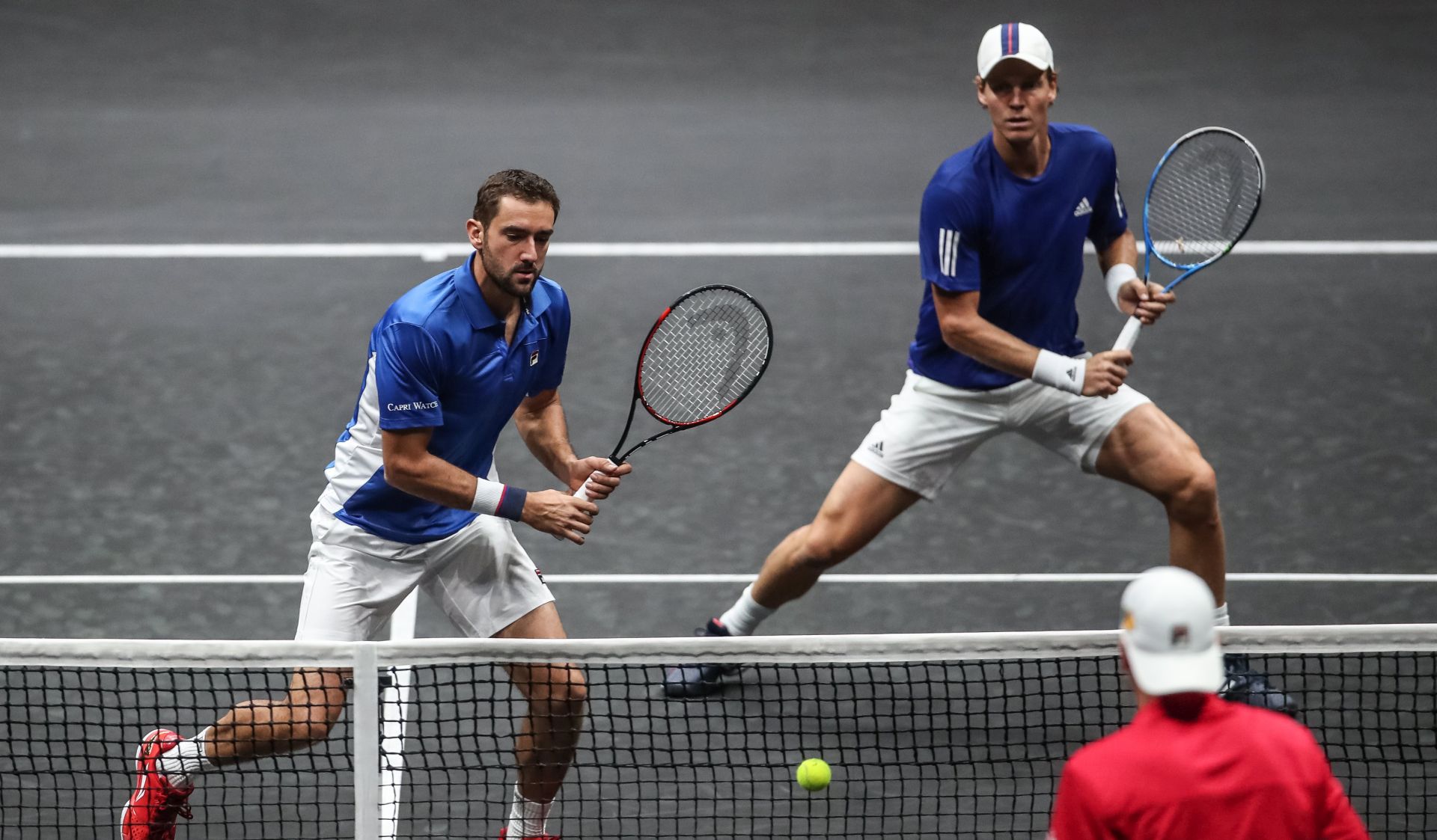 epa06223489 Czech Republic's Tomas Berdych (C) and Croatian Marin Cilic (L) of the Team Europe in action against US Jack Sock and US John Isner (R) of the Team World during the Laver Cup tennis tournament in Prague, Czech Republic, 24 September 2017.  EPA/MARTIN DIVISEK