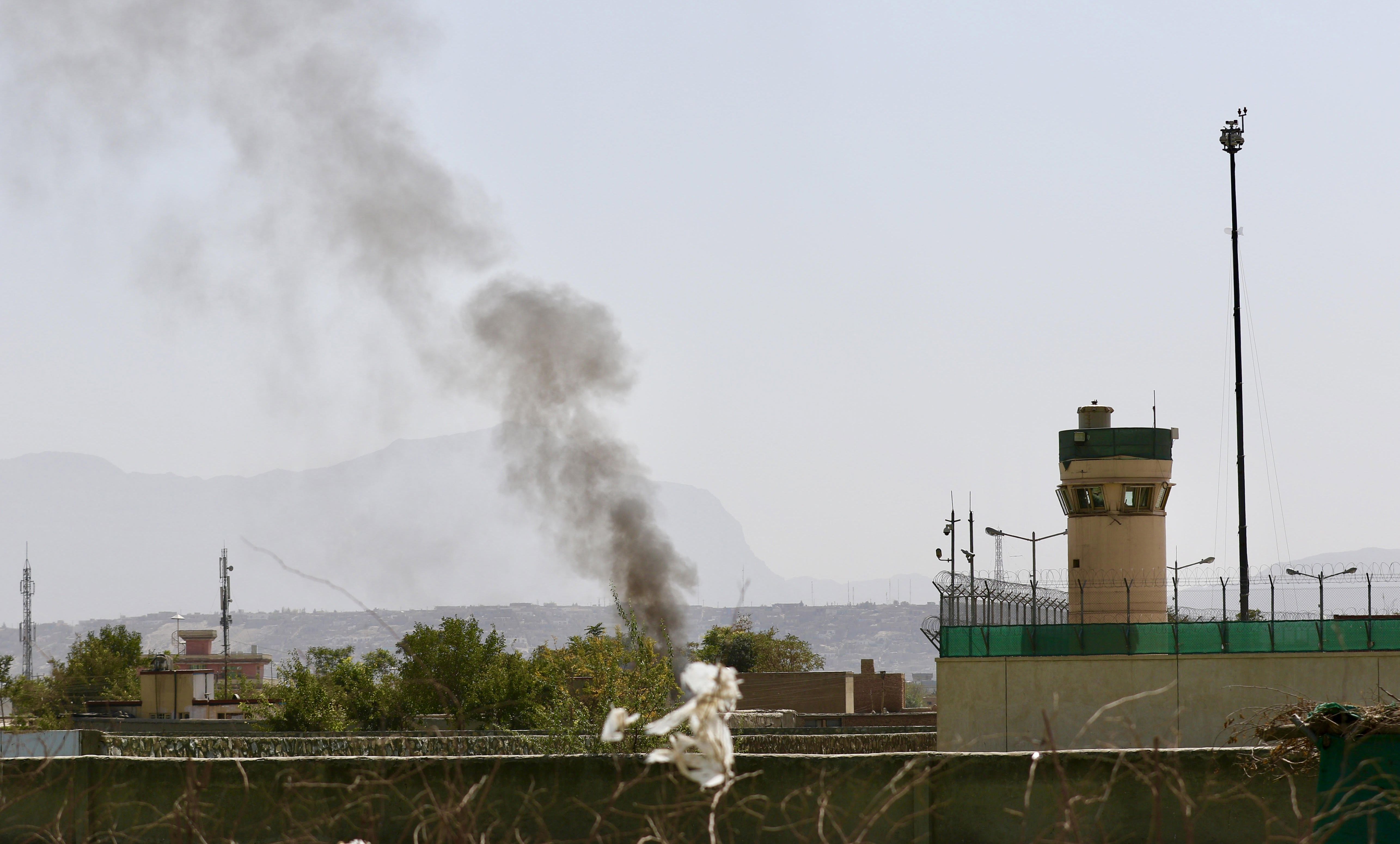 epa06229567 Smoke billows from the scene after six rockets were fired near Kabul airport following the arrival of US Defense Secretary General James Mattis and NATO's Jens Stoltenberg in Kabul, Afghanistan, 27 September 2017. The visit by Mattis is the first since the 21 August announcment by US President Donald Trump for a new strategy in Afghanistan involving an increase in the number of troops deployed in the country and no planned withdrawal date.  EPA/HEDAYATULLAH AMID