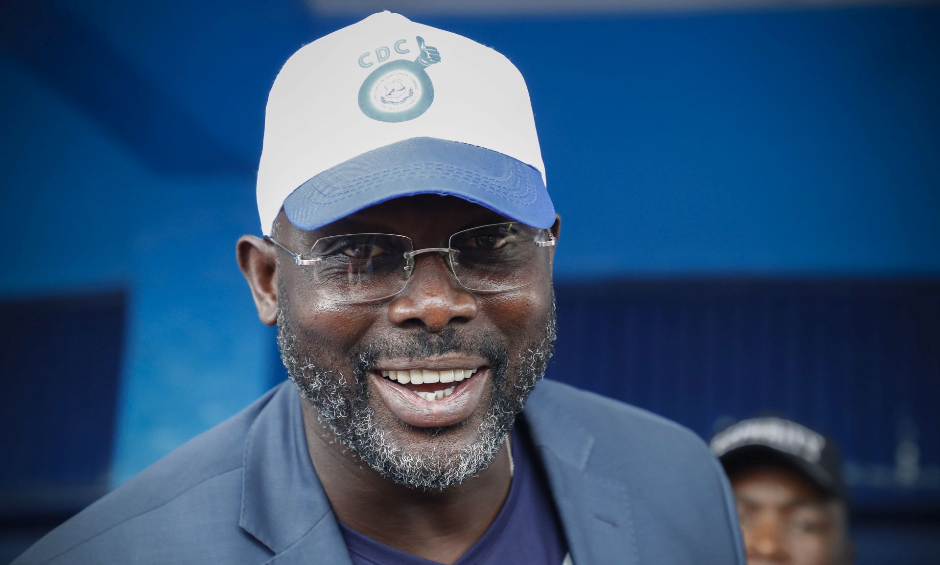 epa06237678 Liberian presidential candidate George Weah from the Congress for Democratic Change (CDC) during a campaign rally in Buchanan, Liberia, 30 September 2017 (issued 01 October 2017). Liberians will head to the polls on 10 October in the very first African nation to obtain independence in 1847. These elecions are hoped to be the first peaceful and democratic transfer of power from Africa's first woman democratically elected president, Ellen Johnson-Sirleaf to a new leader who has to continue in the efforts to rebuilding the country, following nearly two decades of brutal civil war.  EPA/NIC BOTHMA
