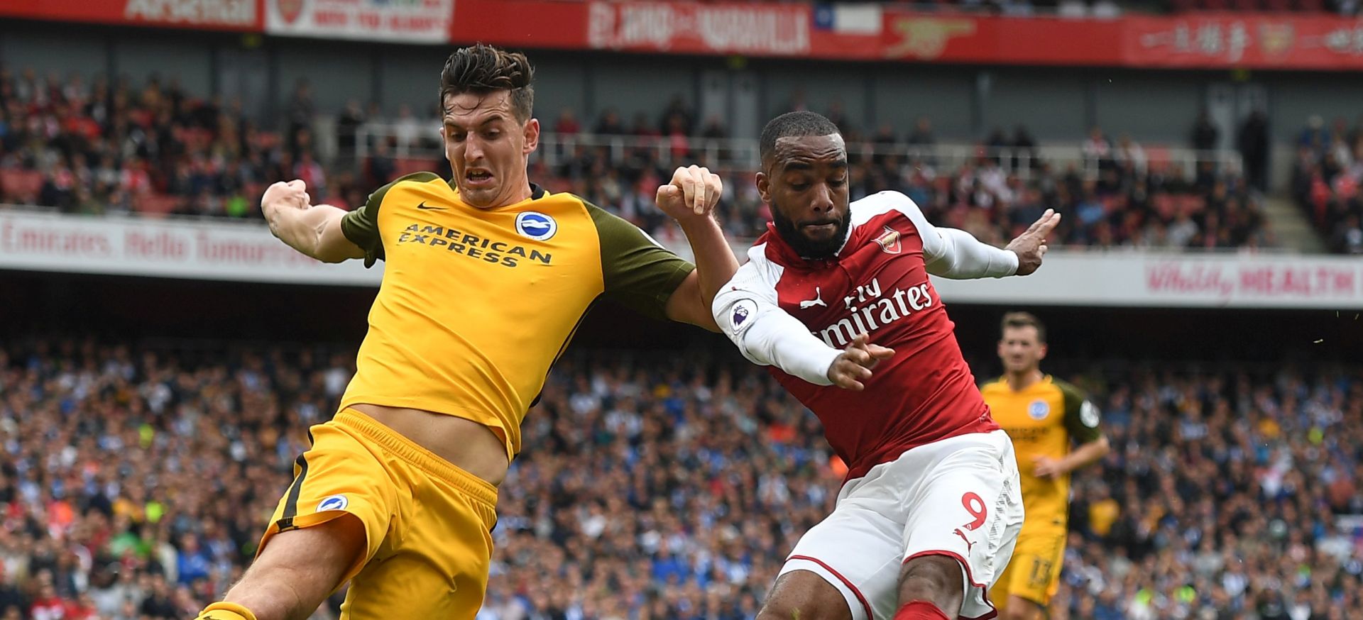 epa06237997 Arsenal's Alexandre Lacazette (R) vies for the ball against  Brighton's Lewis Dunk (L) during the English Premier League soccer match between Arsenal vs Brighton & Hove Albion at Emirates, London, Britain, 1st October 2017.  EPA/WILL OLIVER EDITORIAL USE ONLY. No use with unauthorized audio, video, data, fixture lists, club/league logos or 'live' services. Online in-match use limited to 75 images, no video emulation. No use in betting, games or single club/league/player publications